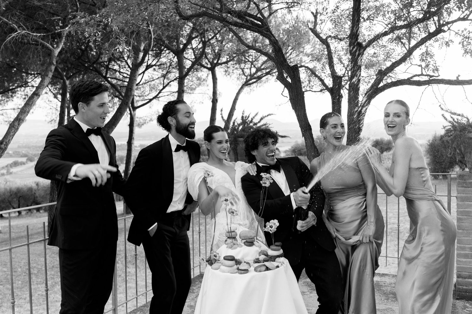 Black and white photo series showing celebratory moments at an outdoor gathering.