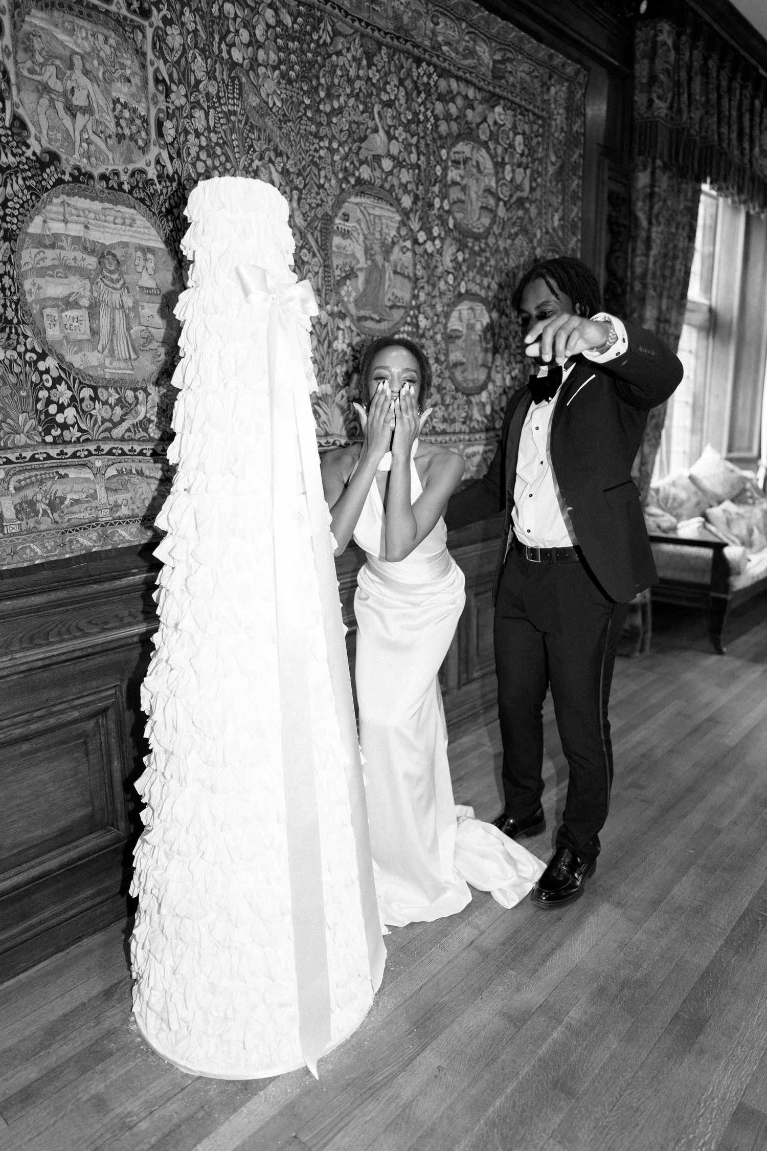 A sequence of five black and white wedding photos showing a couple dancing together in an elegant room with ornate walls.