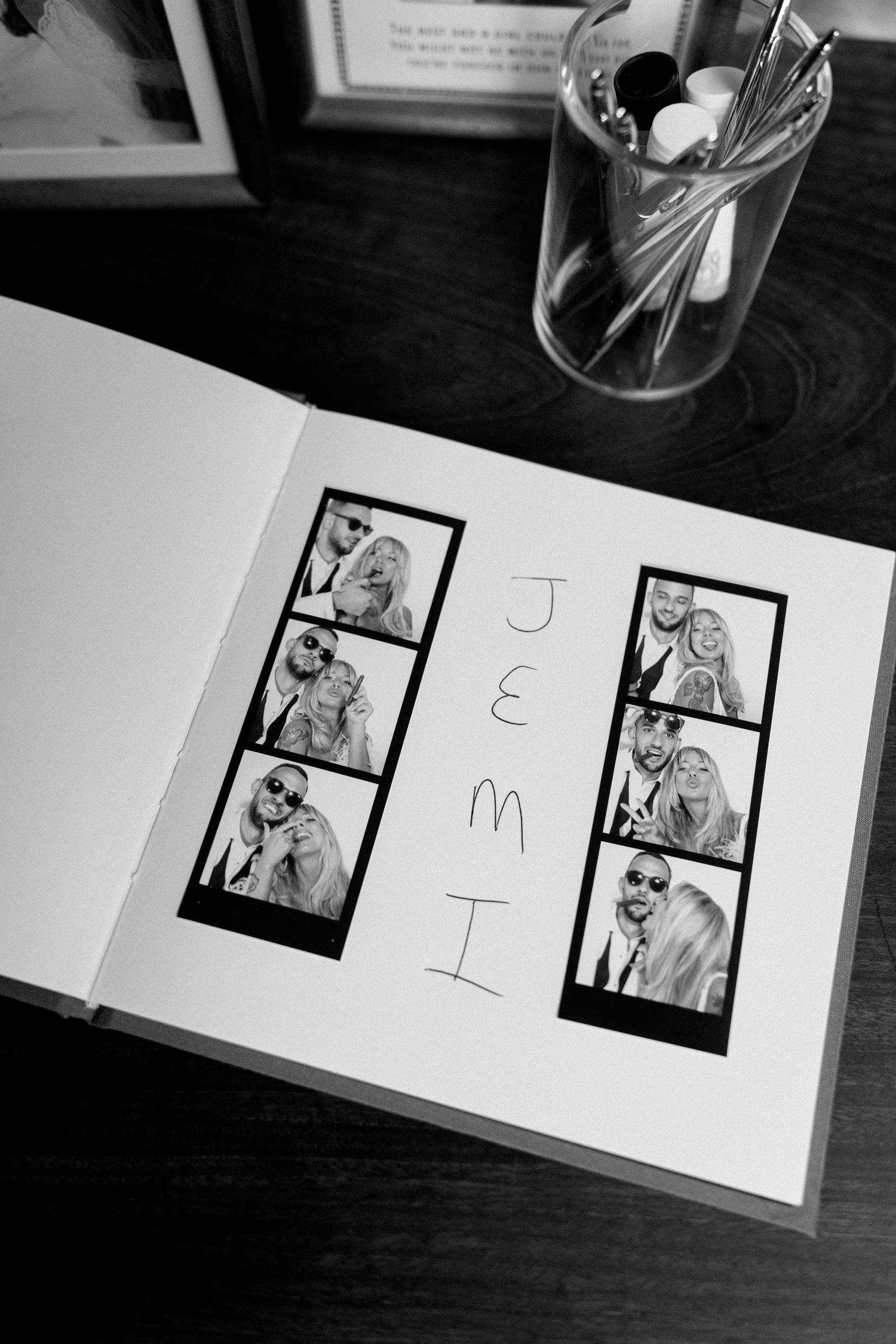 Black and white photo strip layout showing multiple photo booth images in an album.