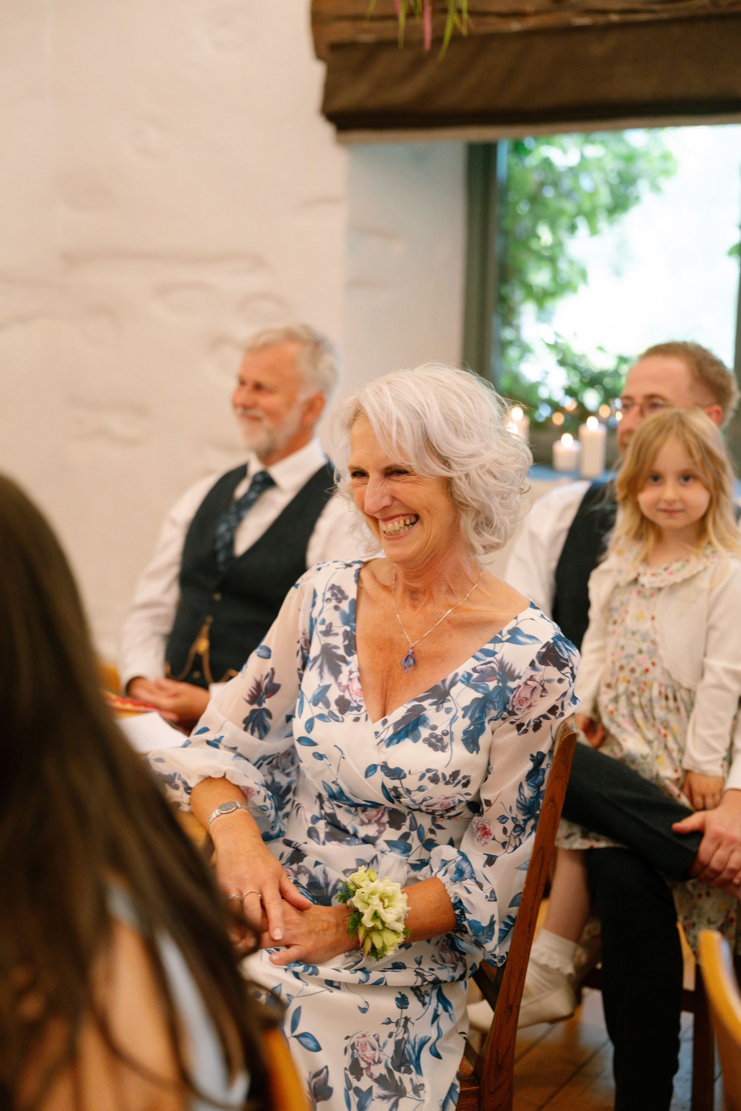Wedding guests enjoying themselves during reception celebration.