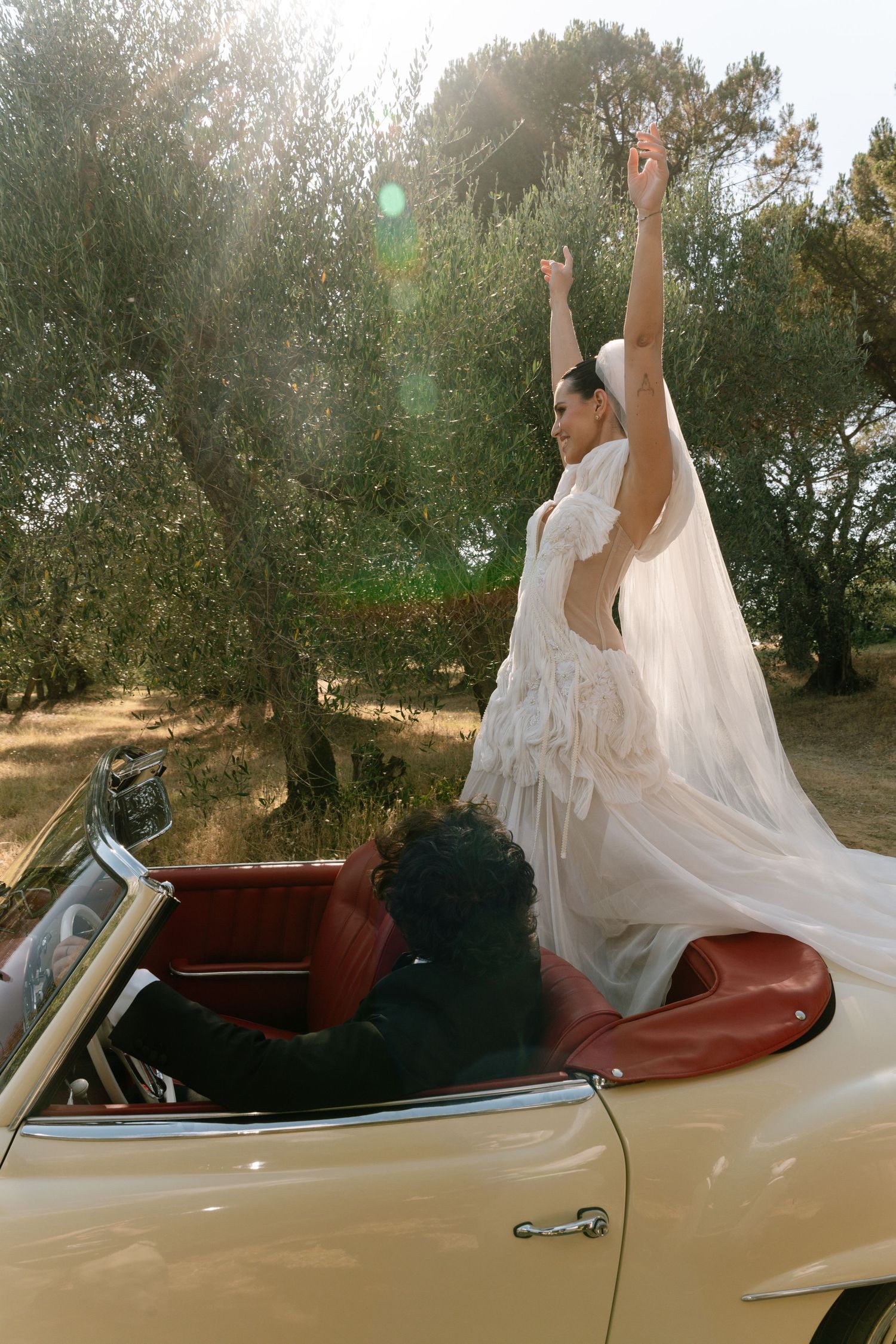 A sequence of joyful moments captured in a vintage convertible car with flowing white fabric against a sunny backdrop.