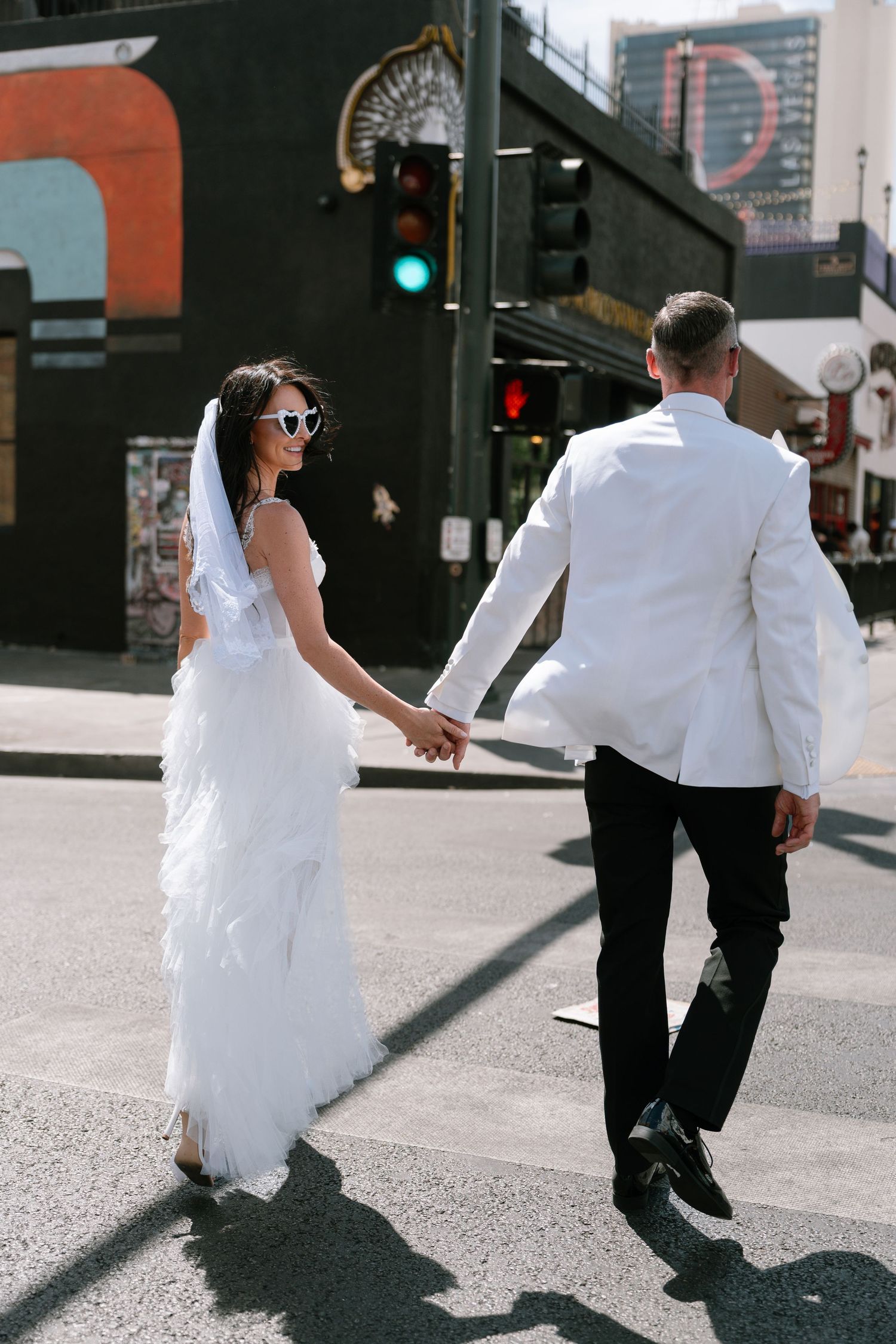 Dynamic street dance sequence showing flowing white dress movement against urban backdrop.