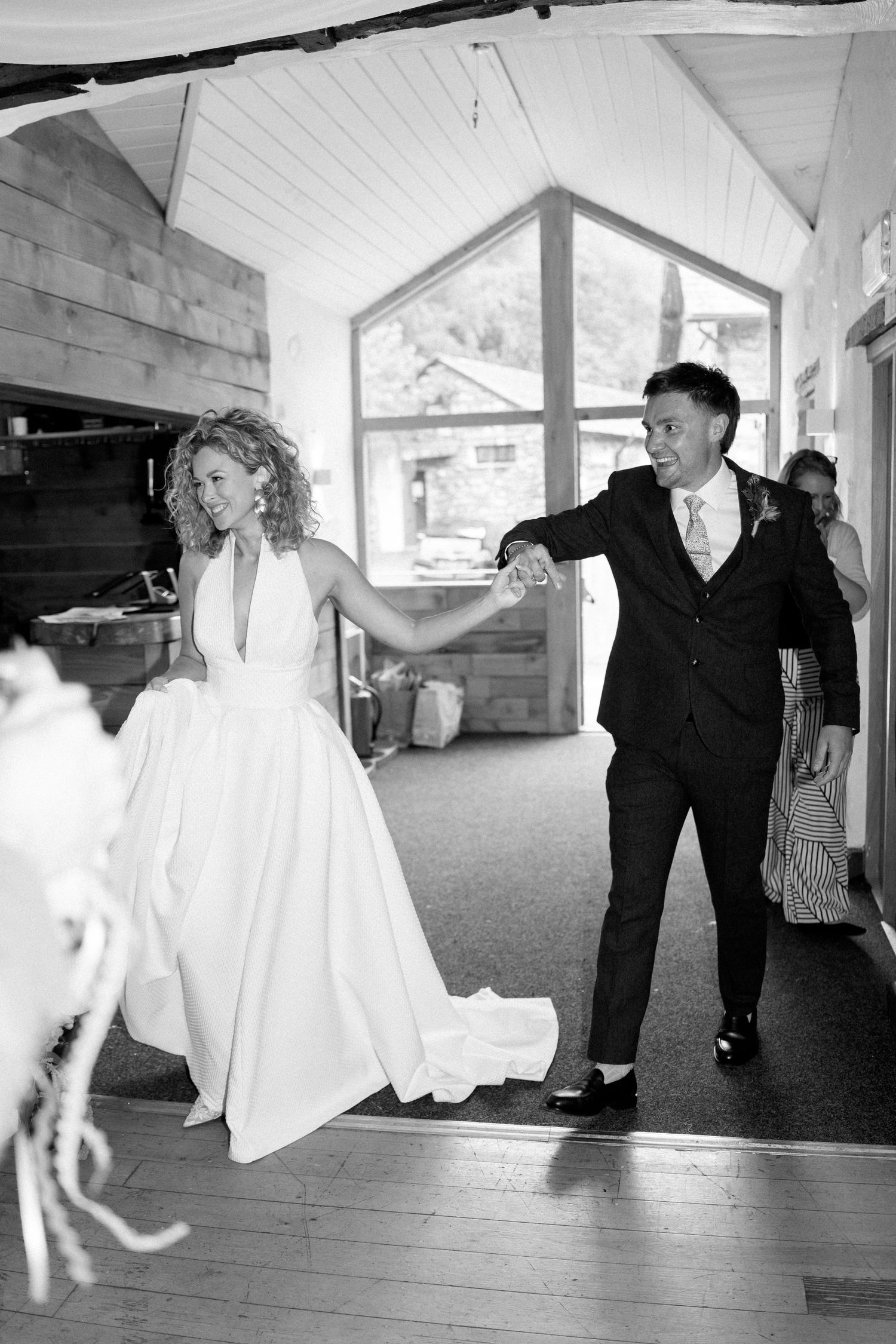 Series of candid dance moves captured in rustic indoor venue.