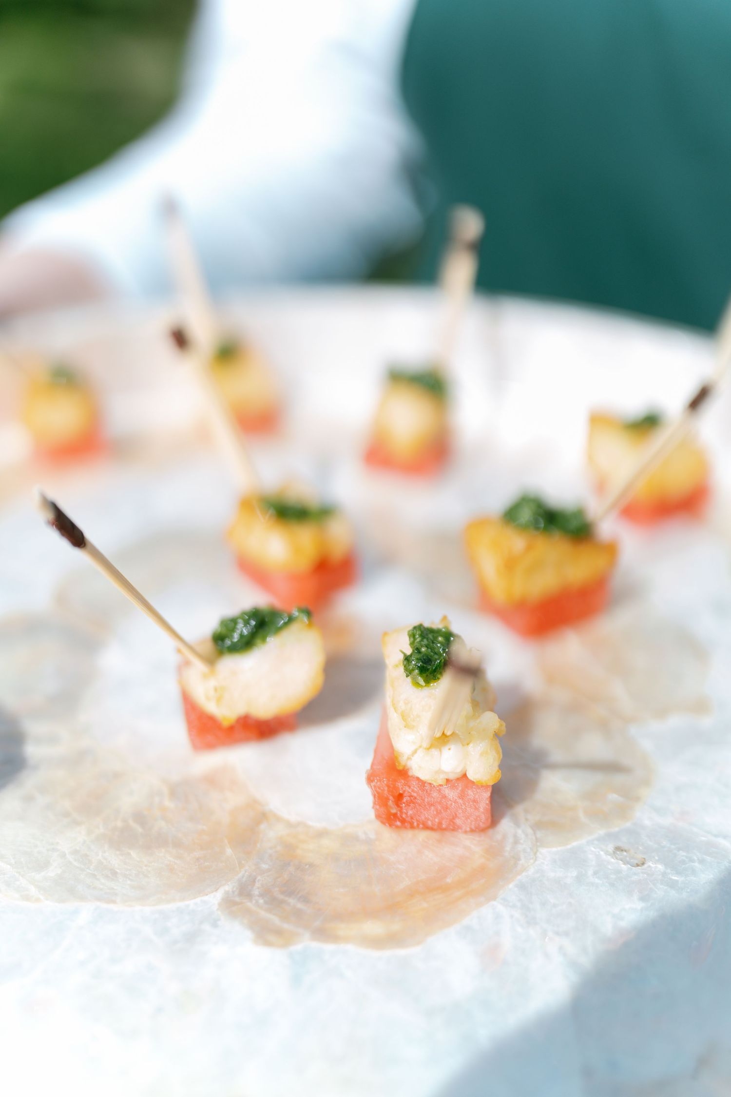 Elegant appetizers displayed on crushed ice at a catered event.
