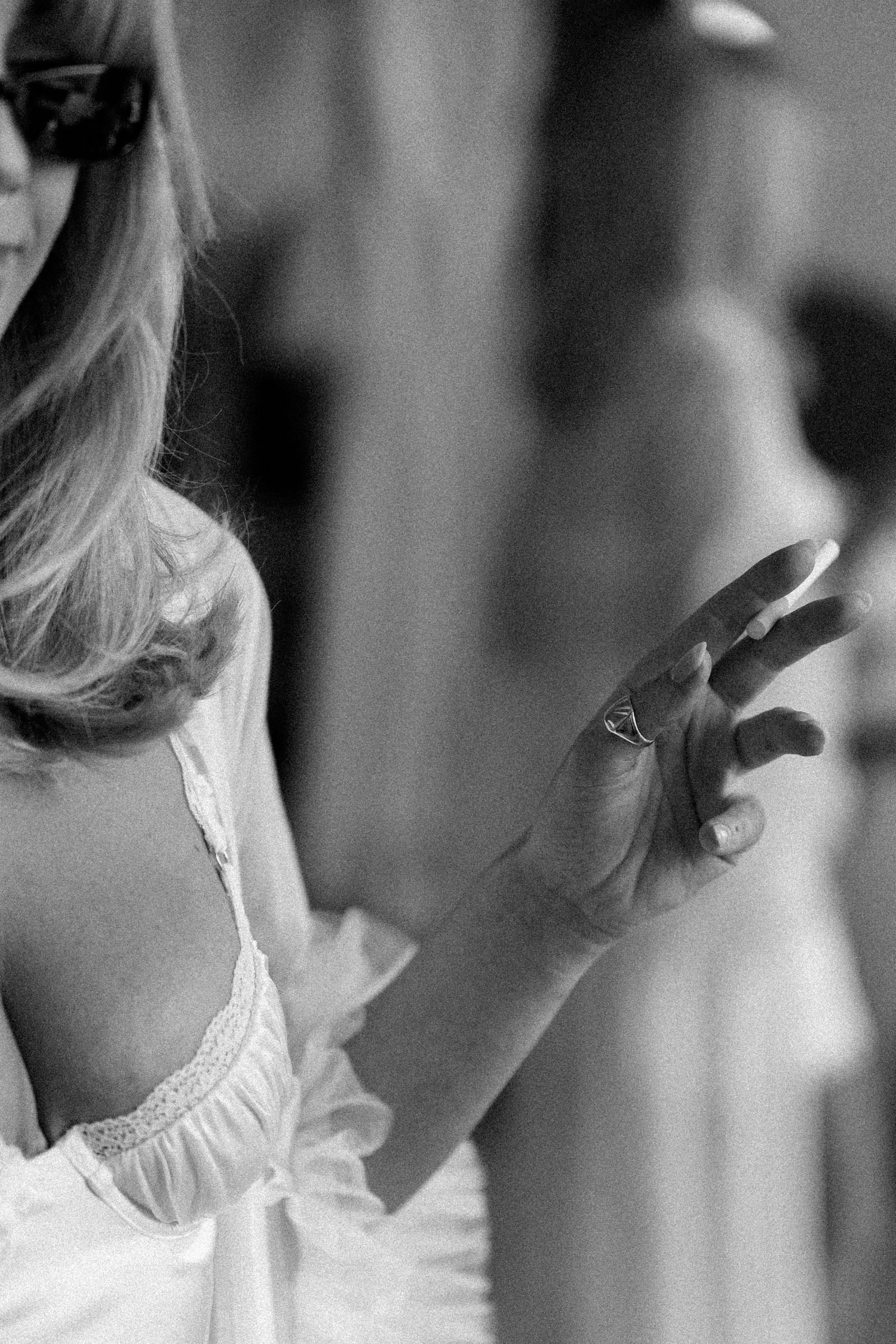 Black and white profile shots showing details of a white lace garment.