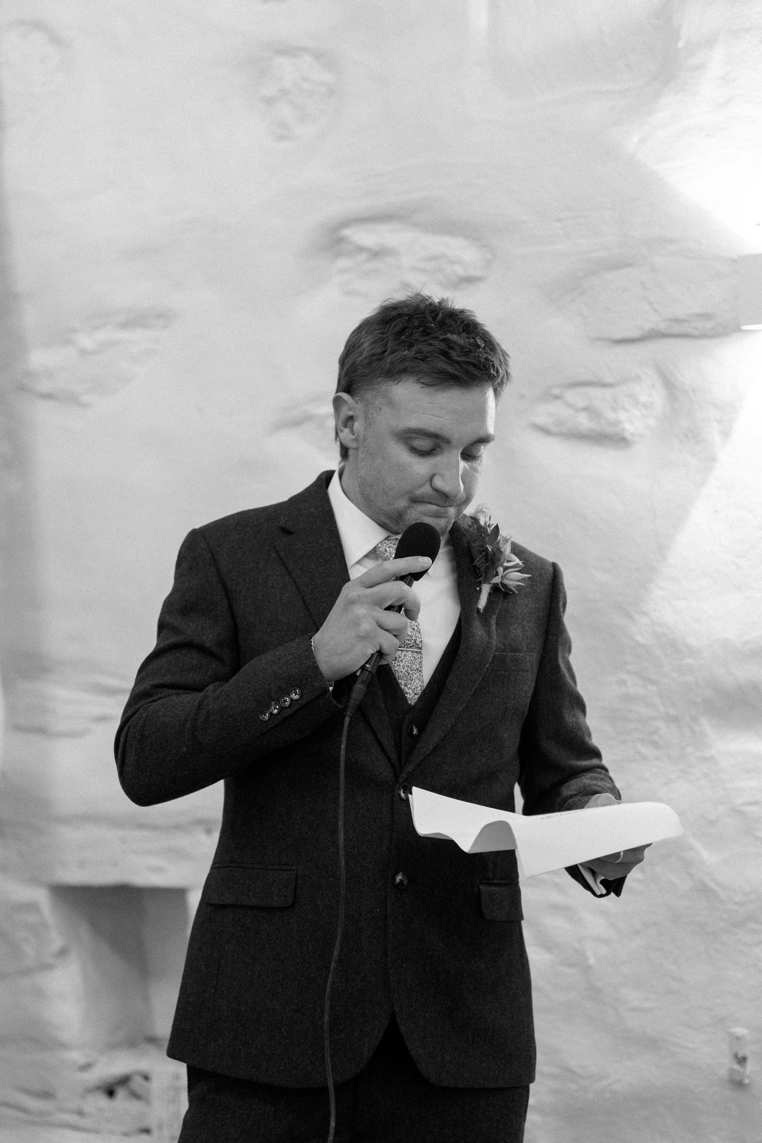 A sequence showing someone in a suit wiping tears from their eyes during an emotional moment.
