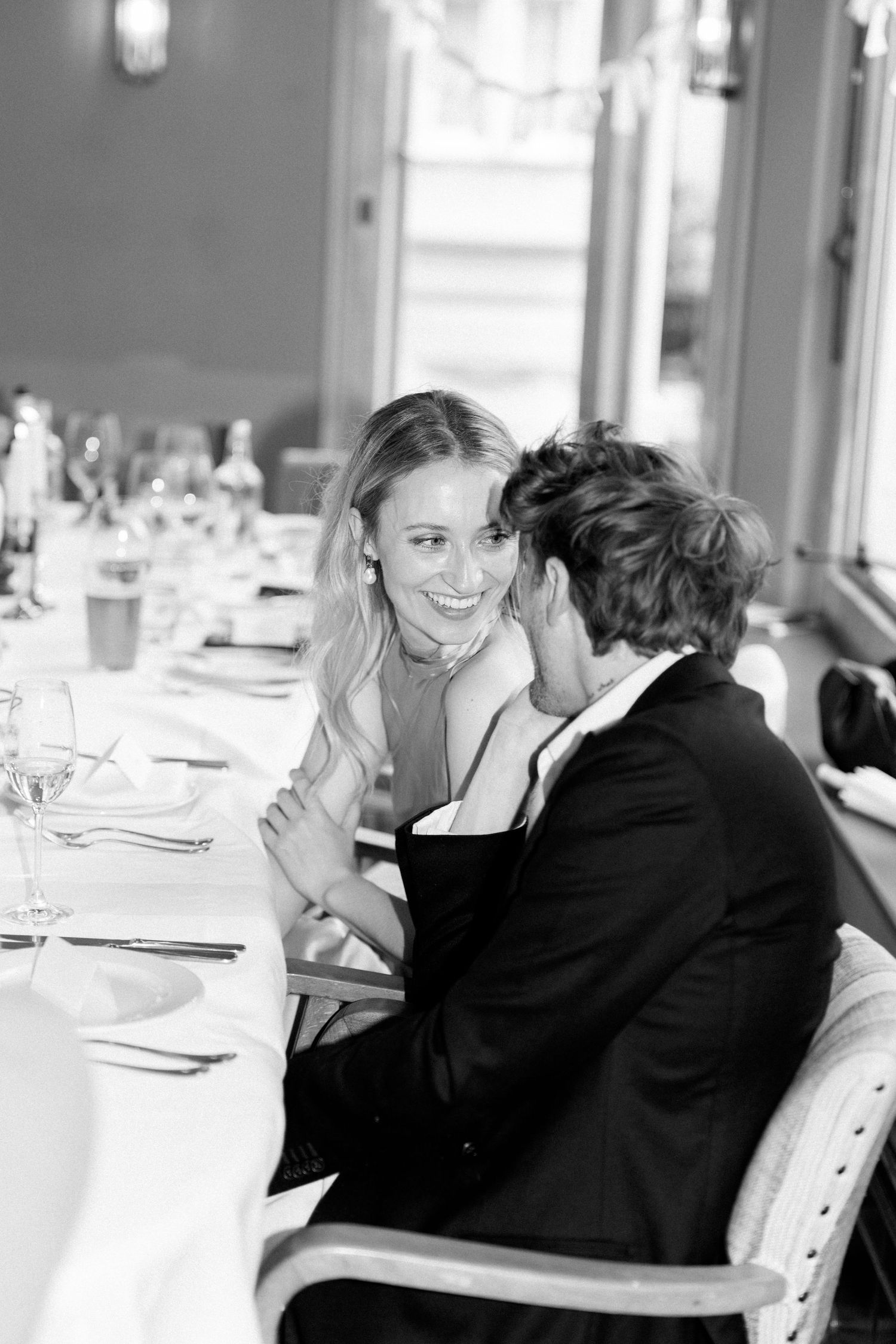 Wedding celebration scene at an elegant dining table with formal place settings.