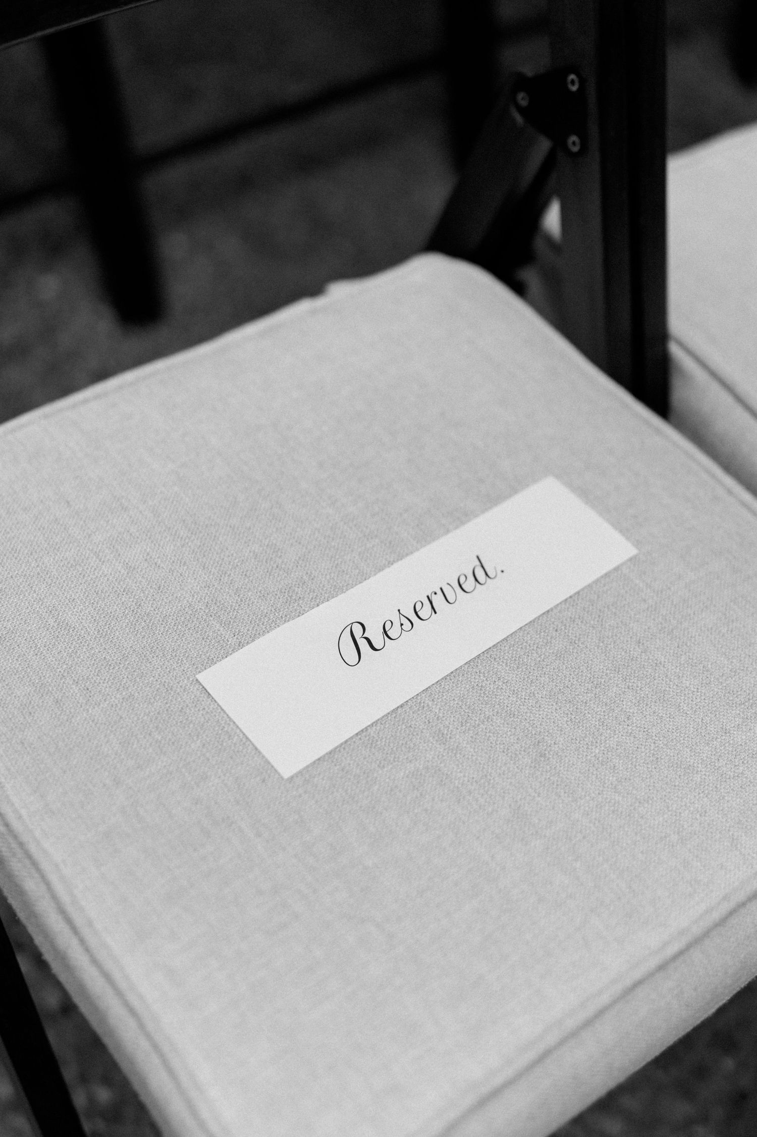 Series of minimalist gray linen notebooks with elegant script text.