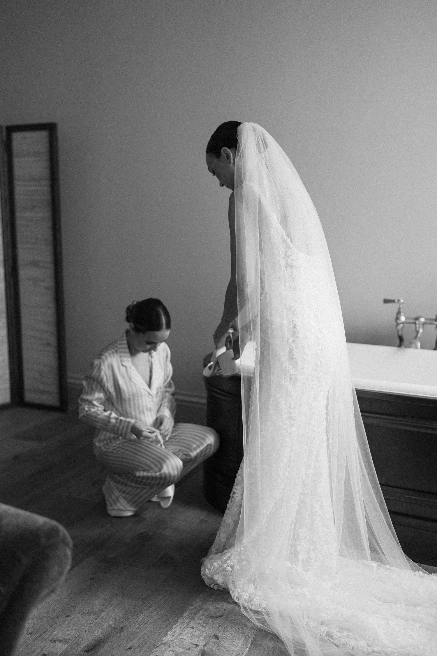 Black and white photos showing wedding dress details and veil preparations.