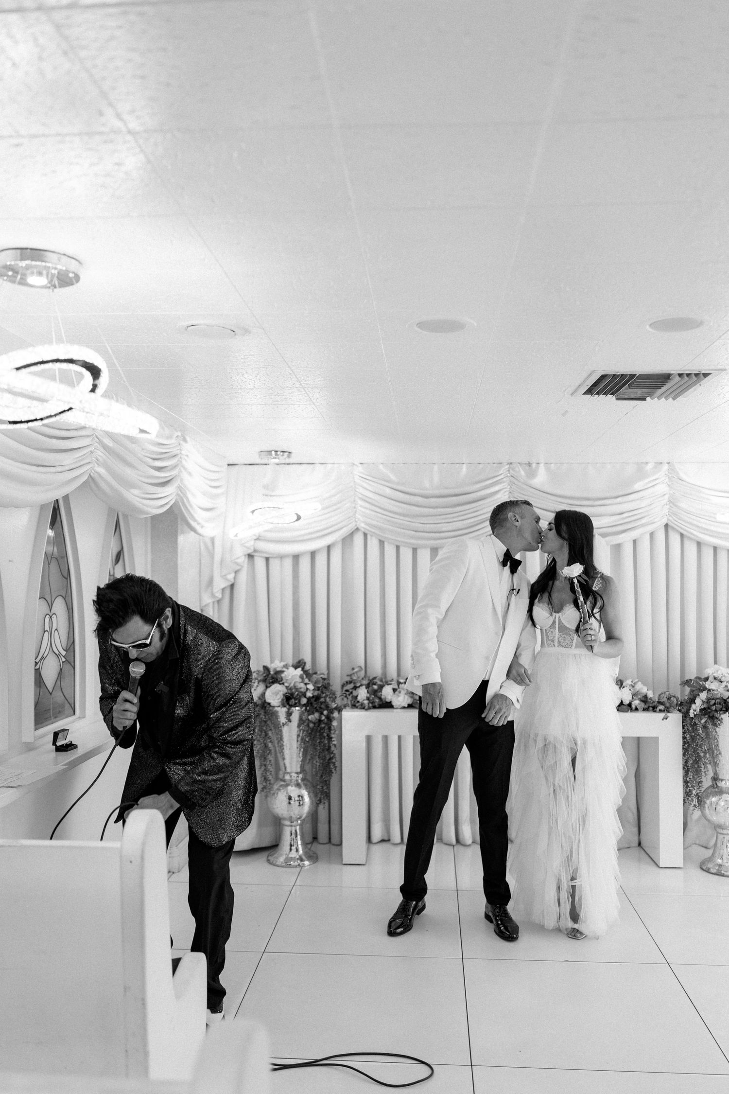 A sequence showing a dance move performed in a white decorated event space.
