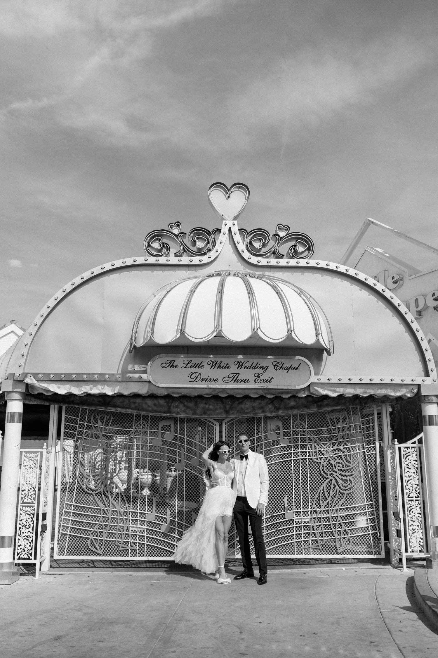 Black and white panorama of a vintage Las Vegas wedding chapel exterior.