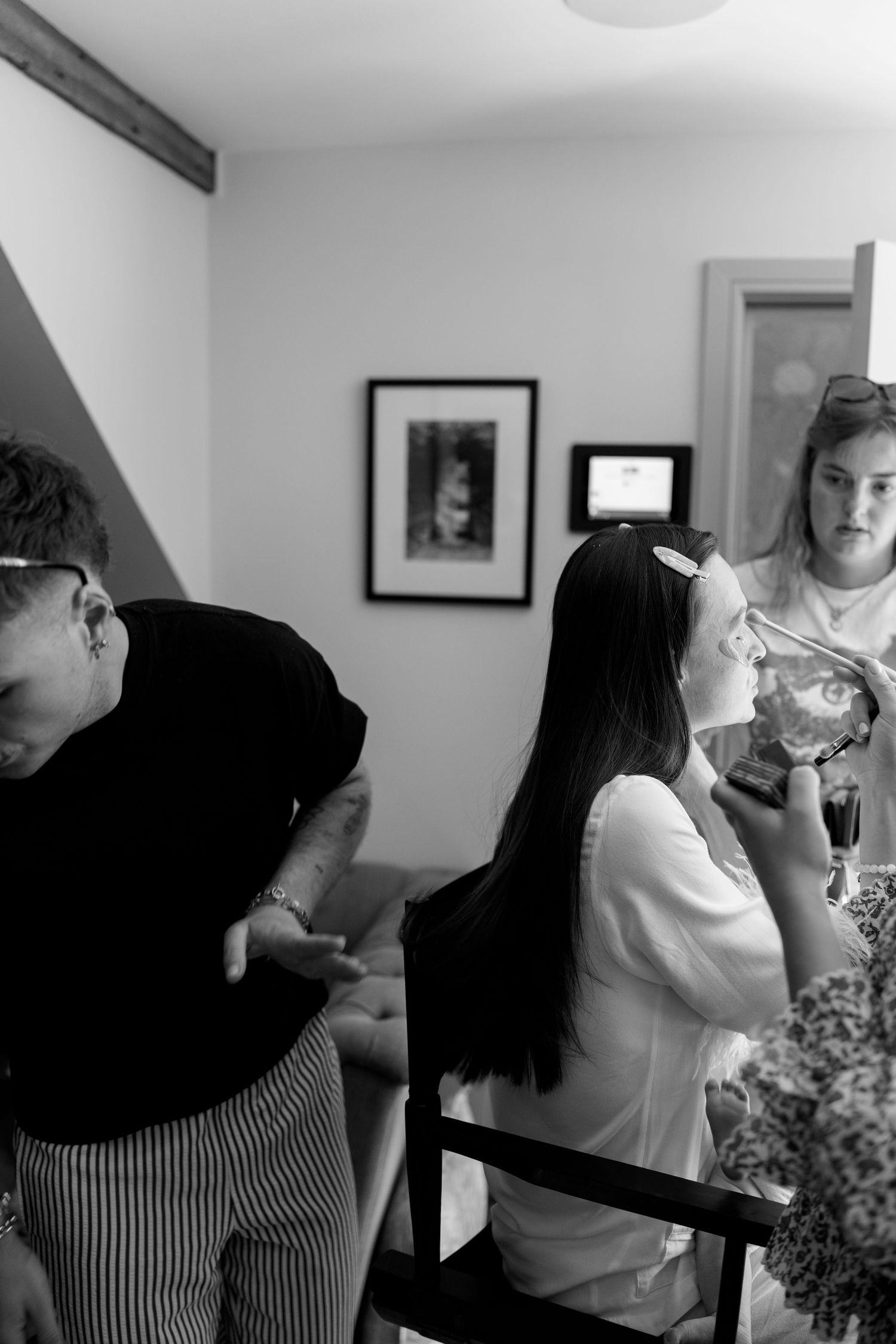 People preparing and getting ready in a bright interior room.