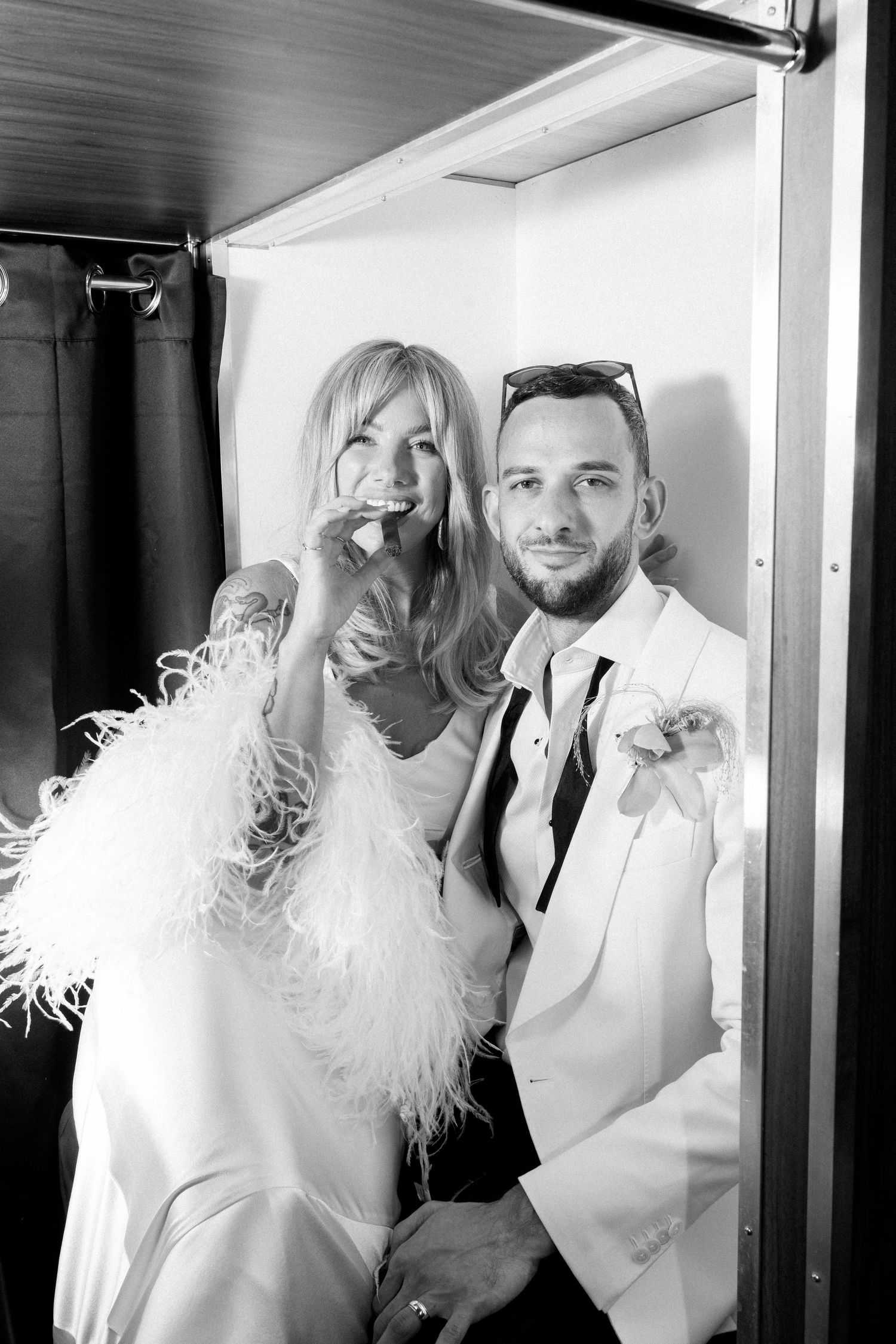 Black and white photo sequence of couple in white outfits with feather accessories.