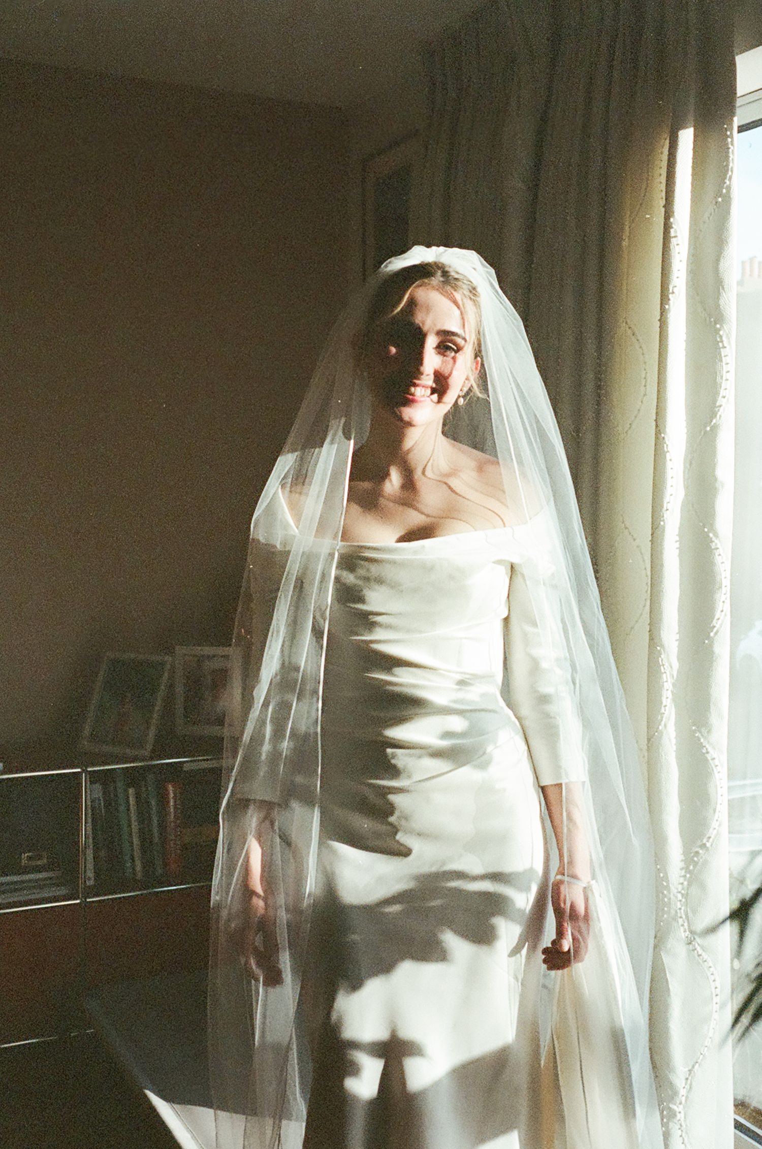 A series of ethereal bridal portraits showing a figure in a white wedding dress and veil against a softly lit interior.