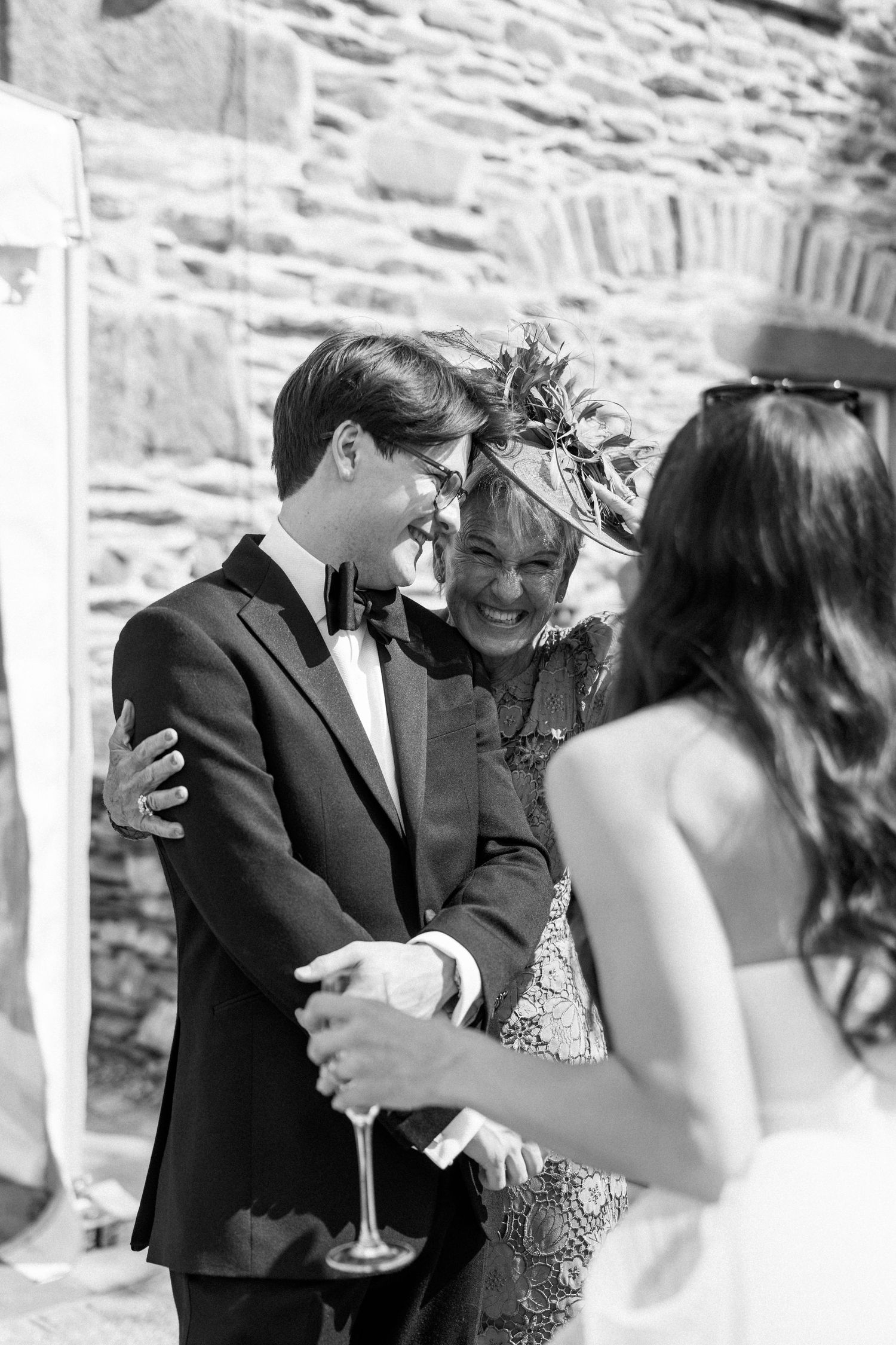 Candid moments captured during an outdoor wedding celebration.