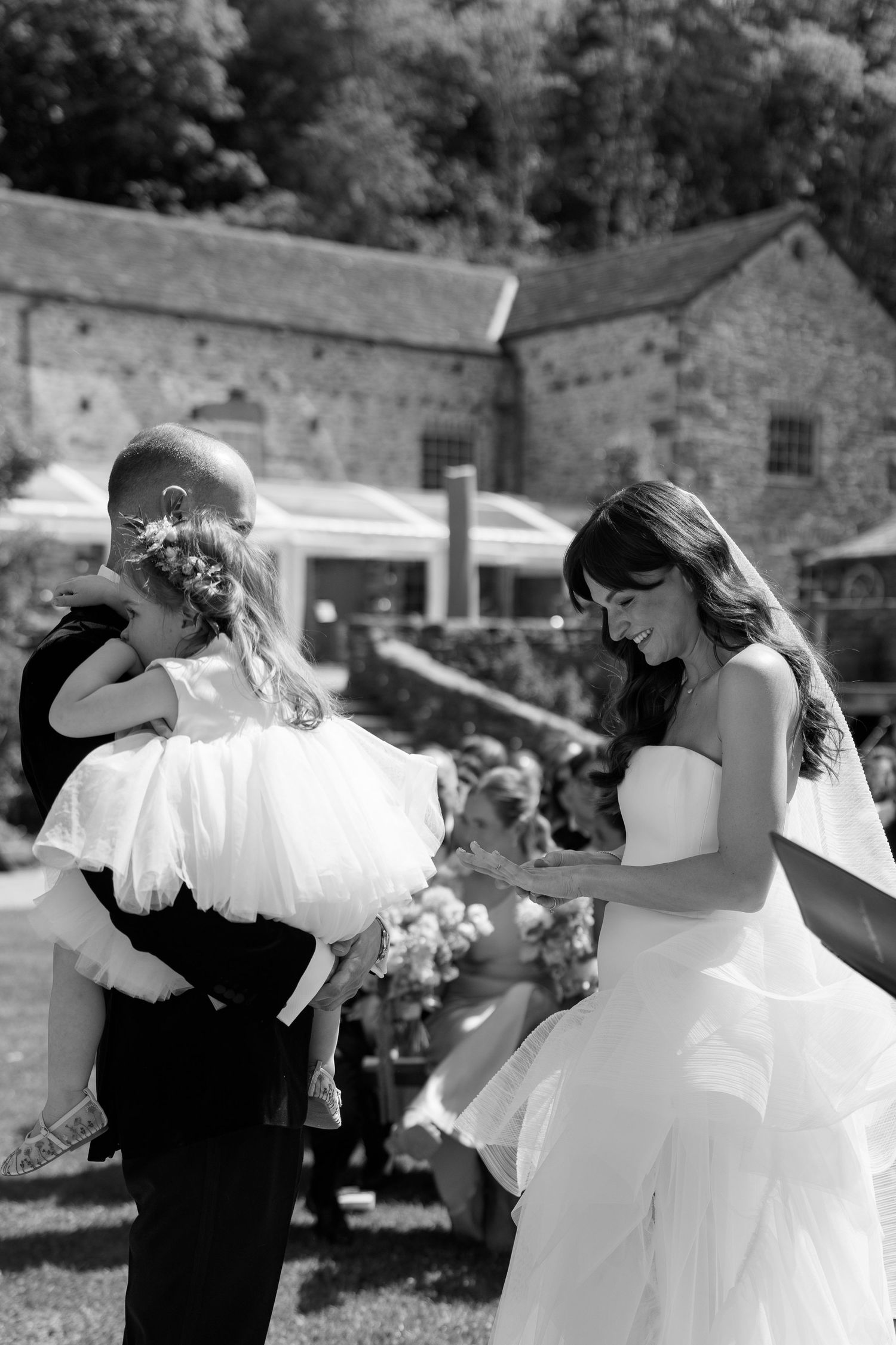 Wedding couple performs choreographed dance moves at outdoor reception.