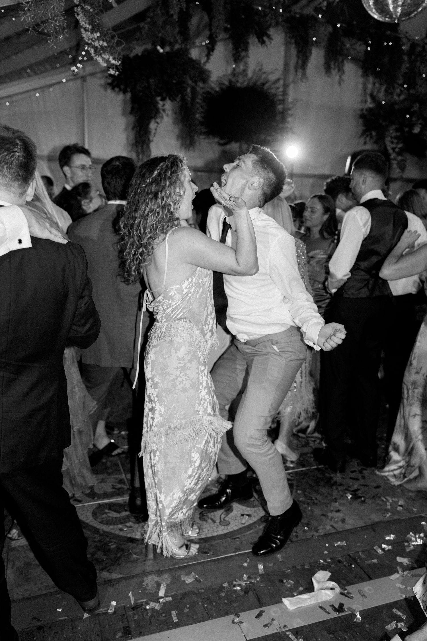 Dance floor scene with party guests moving to the music at a festive celebration.