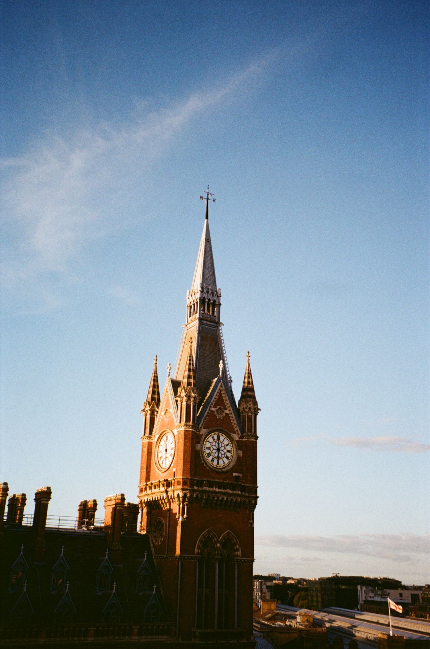 Gothic church spires and clock tower silhouetted against a bright blue sky in a sequence of architectural photos.