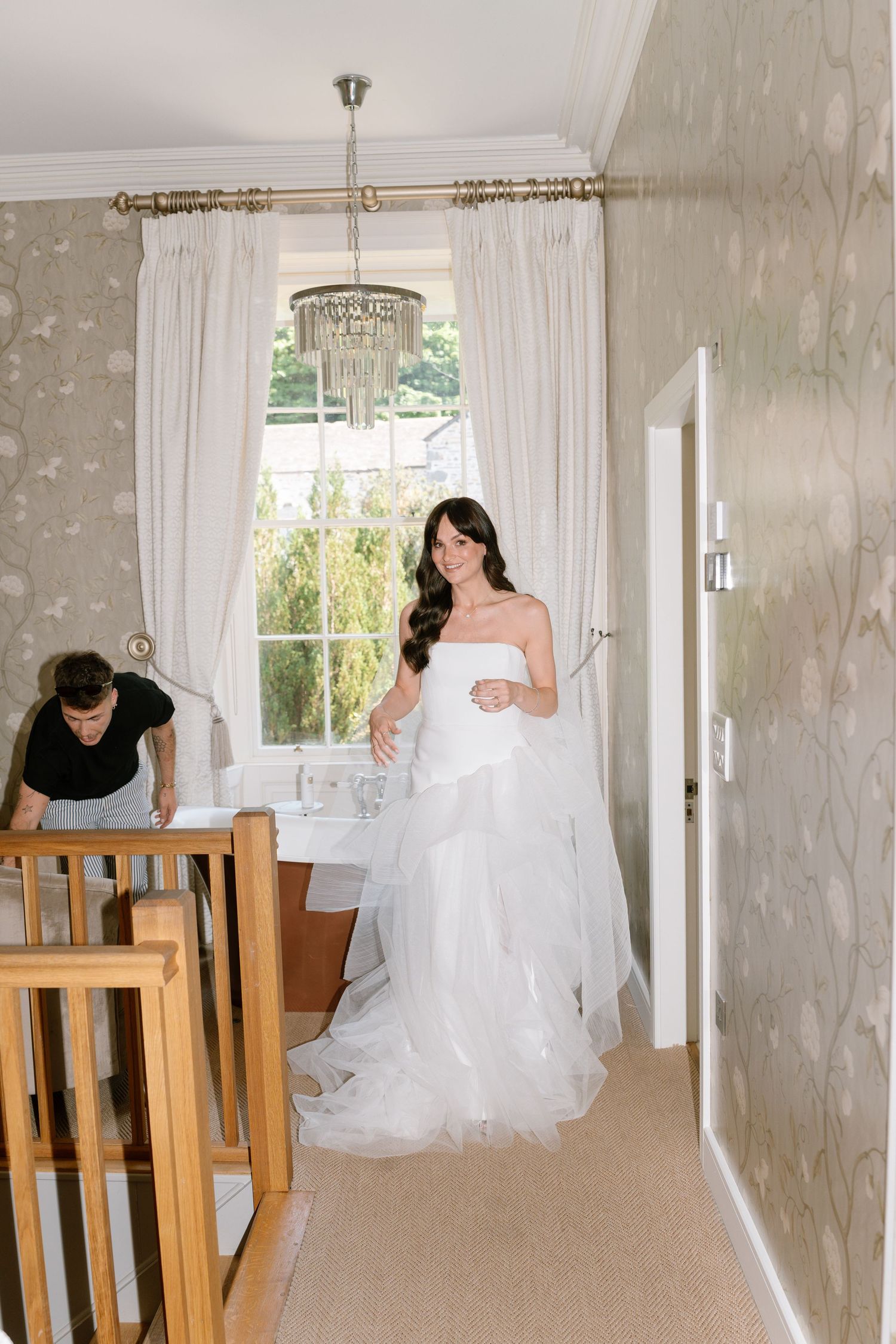 Series showing dynamic poses and movements in a bright hallway with wooden furniture.