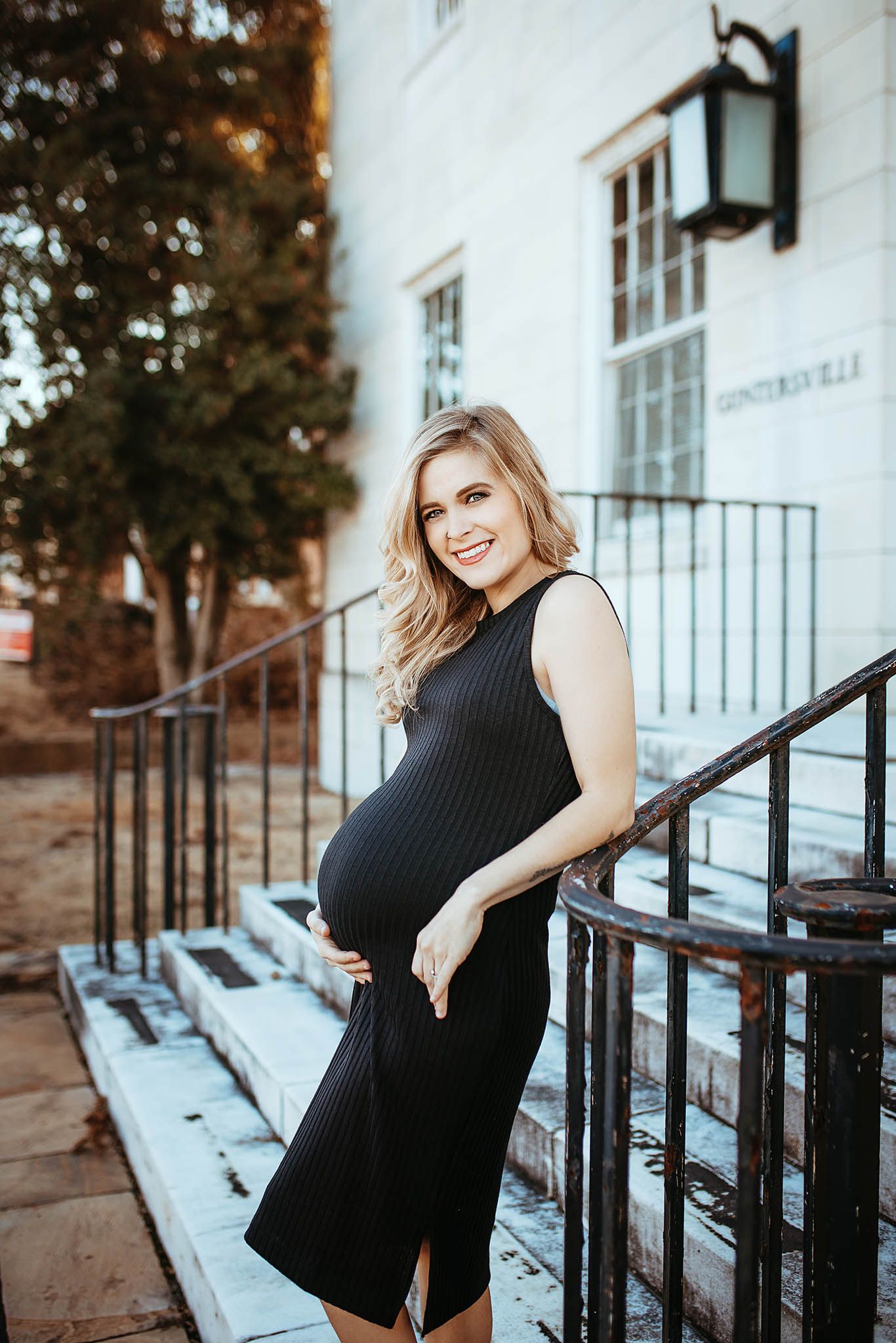 Classic black and white maternity portraits on vintage building steps.