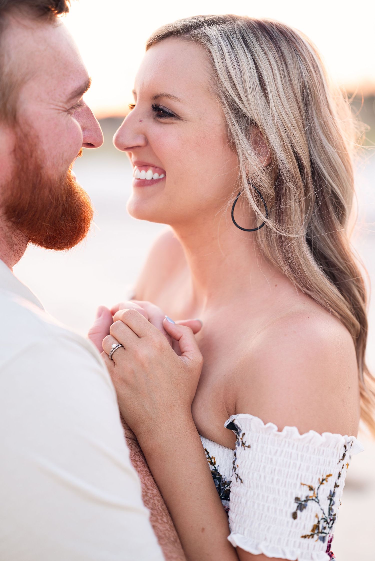 Close-up engagement photos showing loving expressions and smiles.