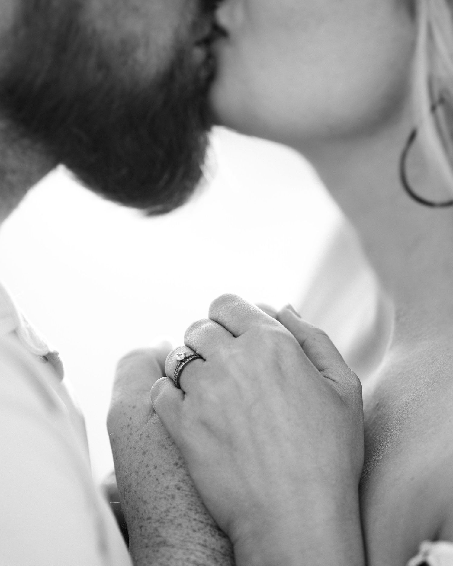 Black and white intimate close-up photos showing tender moments.