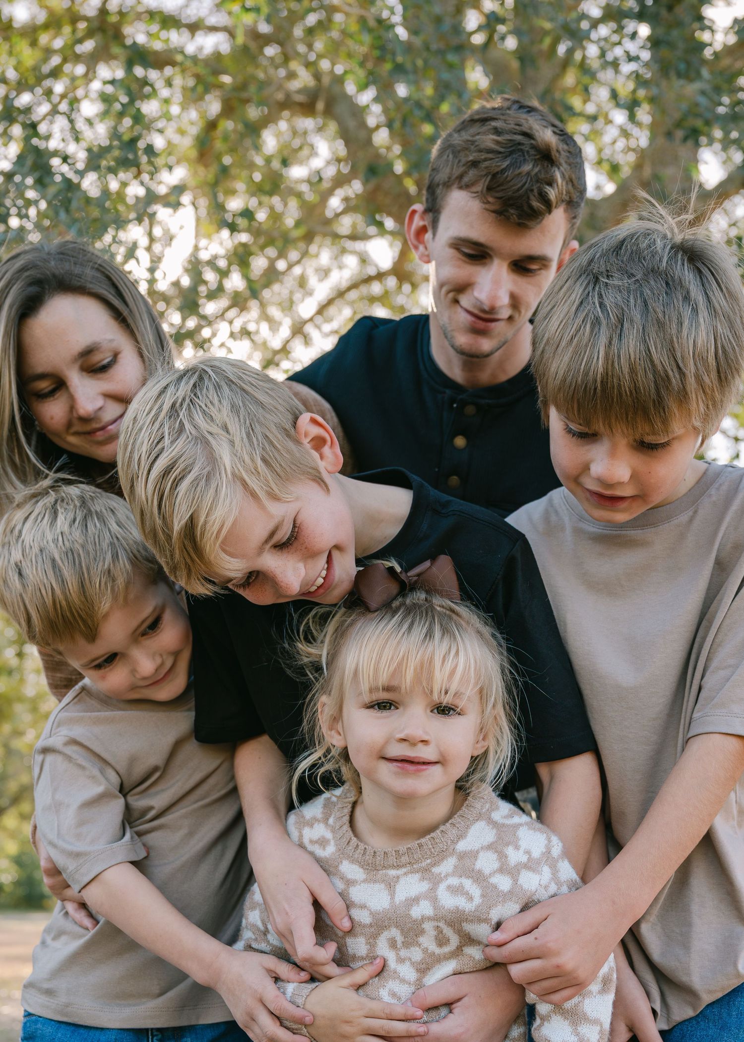 A group shares joyful moments together in a series of candid outdoor photos.