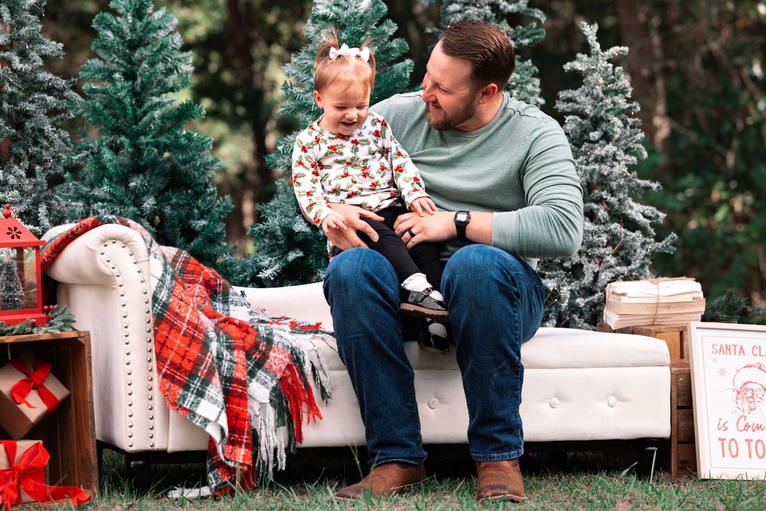 Family holiday photoshoot setup with wooden crates and Christmas decorations.