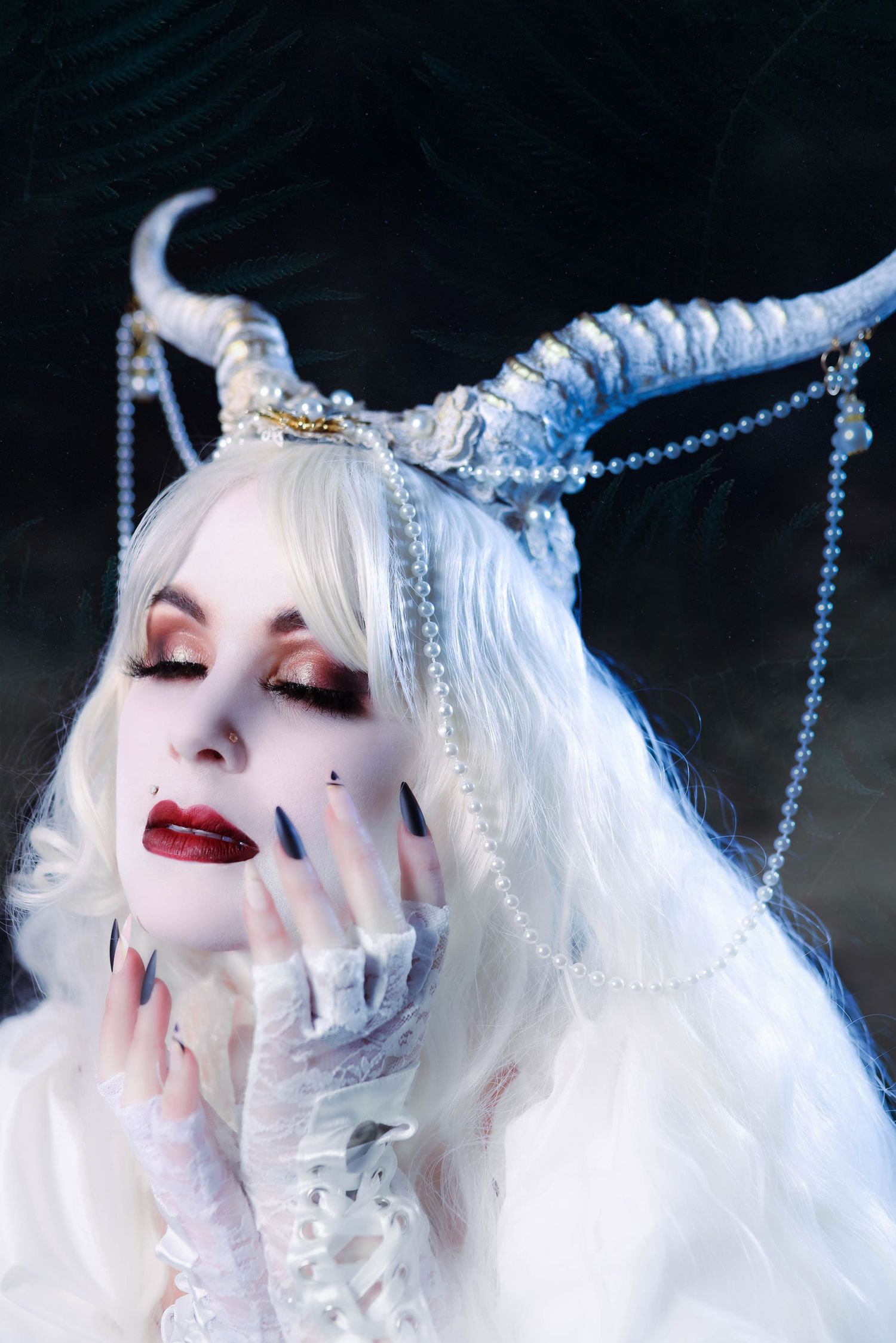 Fantasy themed photographic portrait series featuring ethereal white hair and pearls against a dark background.