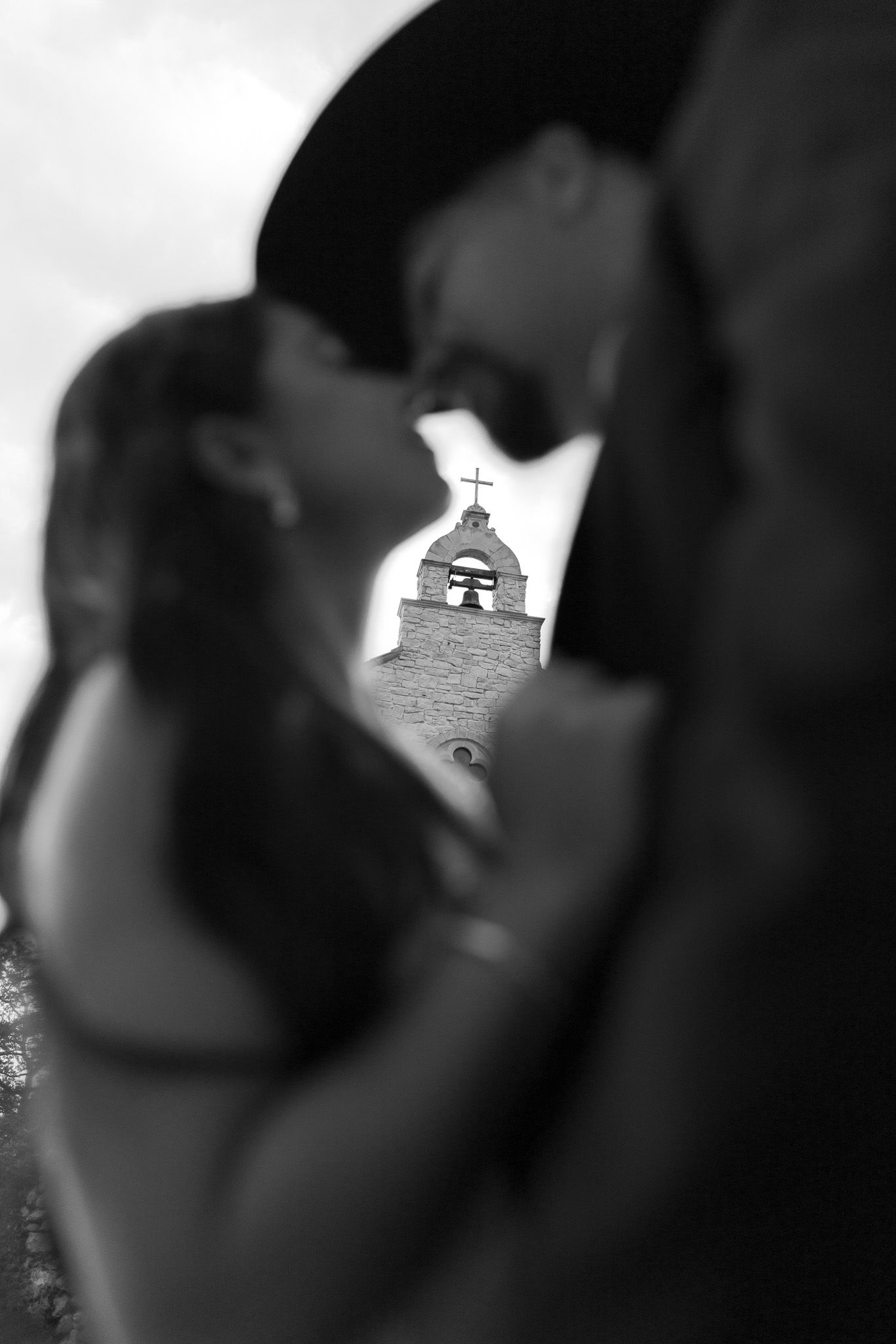 Artistic black and white silhouette shots capturing intimate moments between a couple.