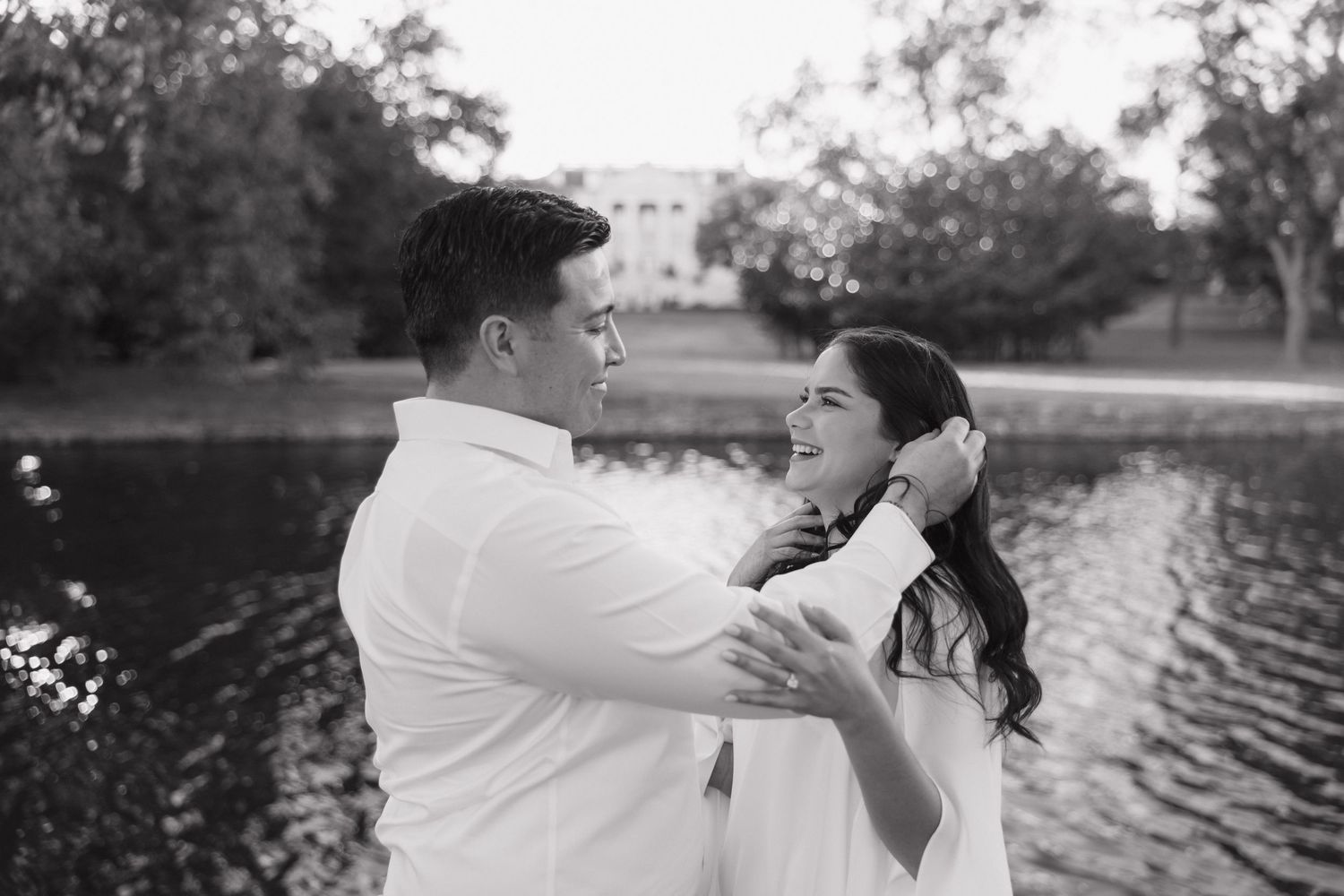 A romantic black and white photo sequence of a couple dancing and embracing by a lake.
