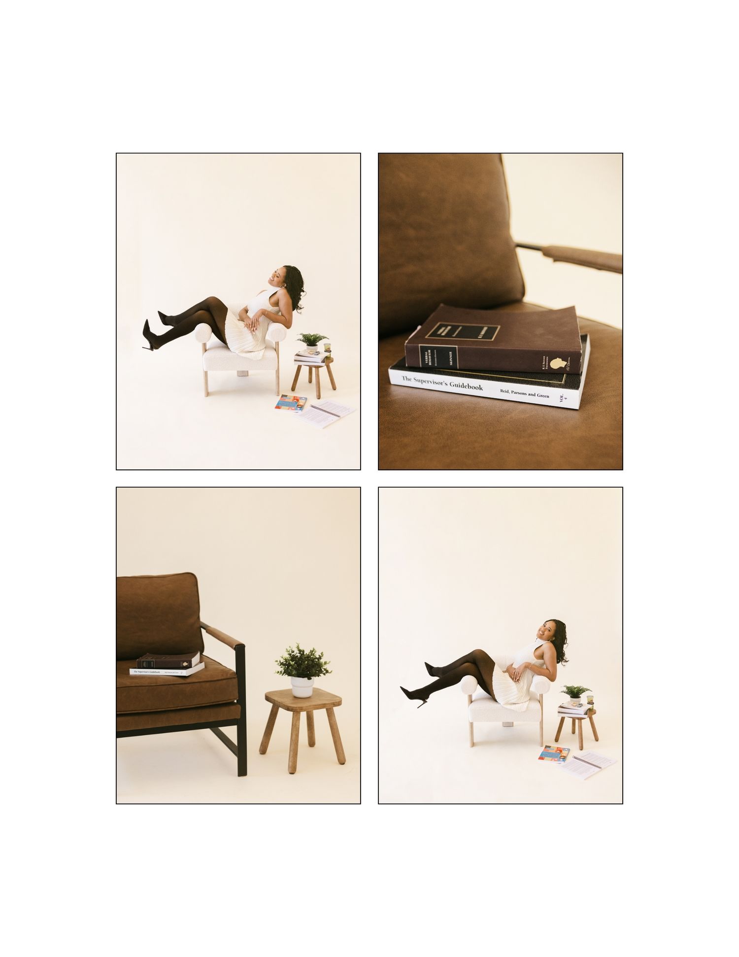 Woman working on laptop beside a small plant table, with a brown armchair and stacked books in a minimalist beige studio.