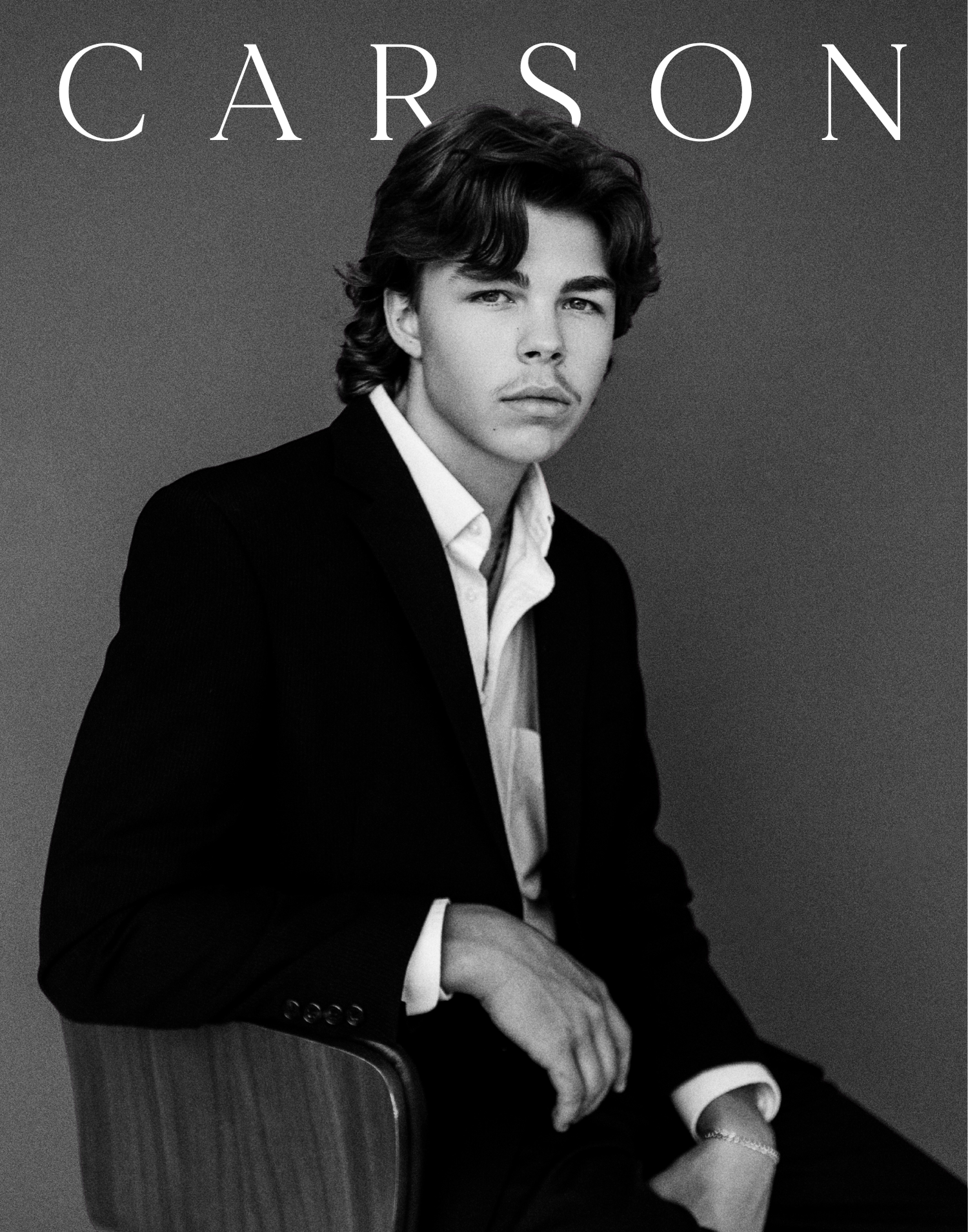Black and white portrait of a young man in a blazer on Carson magazine cover.