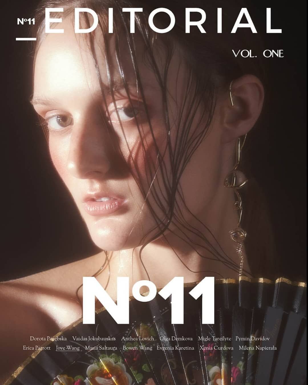 Editorial magazine No.11 cover featuring model with wet hair holding a decorative fan.