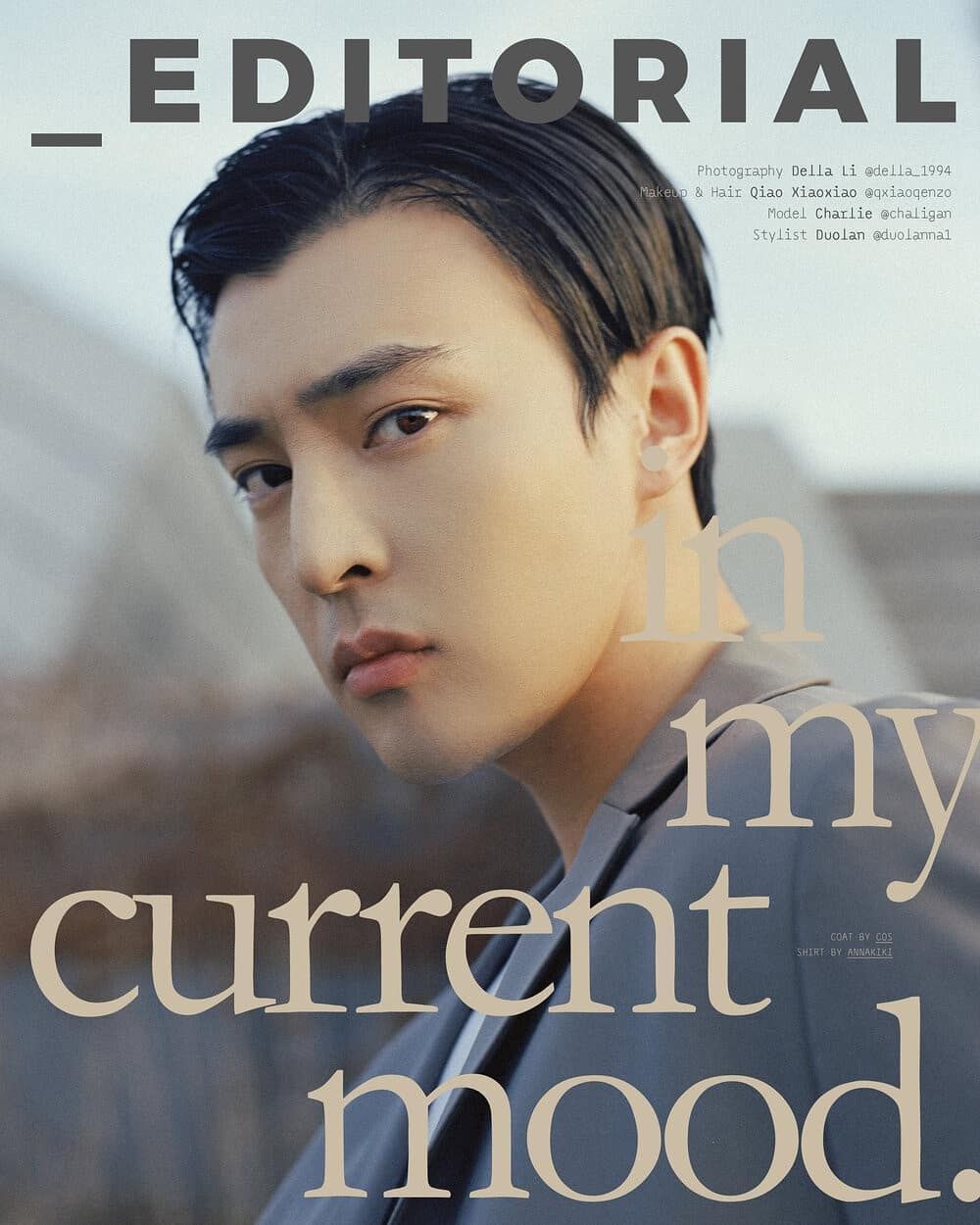 Editorial magazine cover featuring a male model in grey suit with bold typography reading in my current mood.