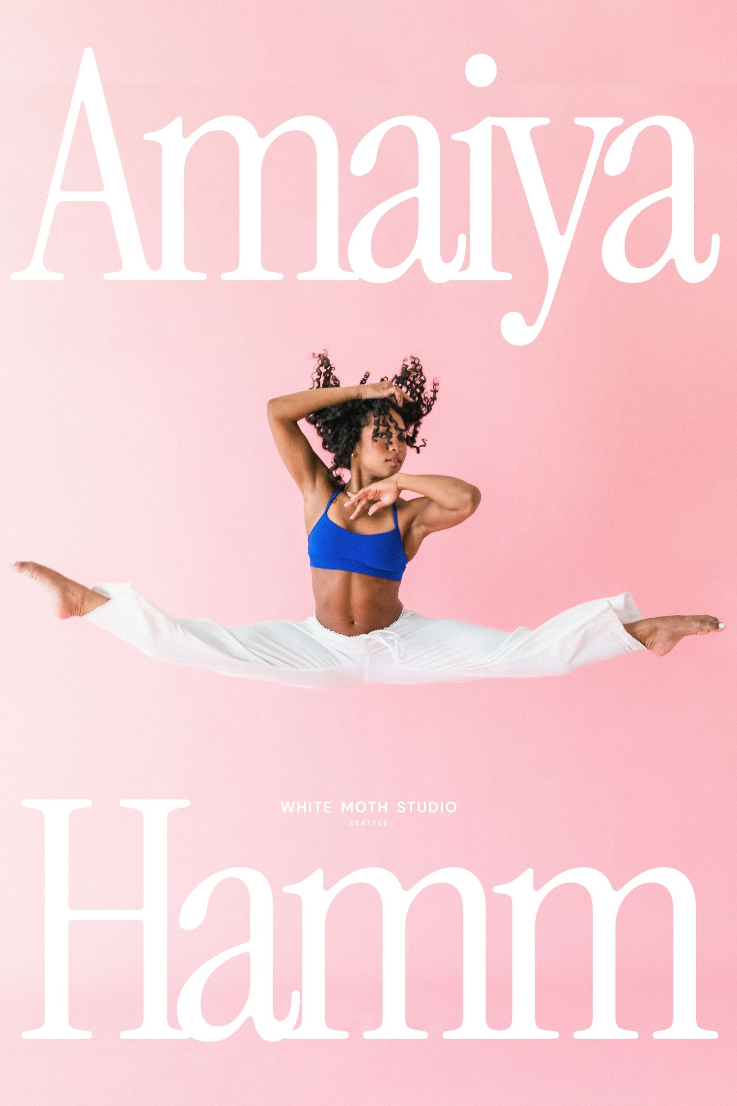 Dancer Amaiya Hamm performs a mid-air split in a blue crop top and white pants against a pink background.