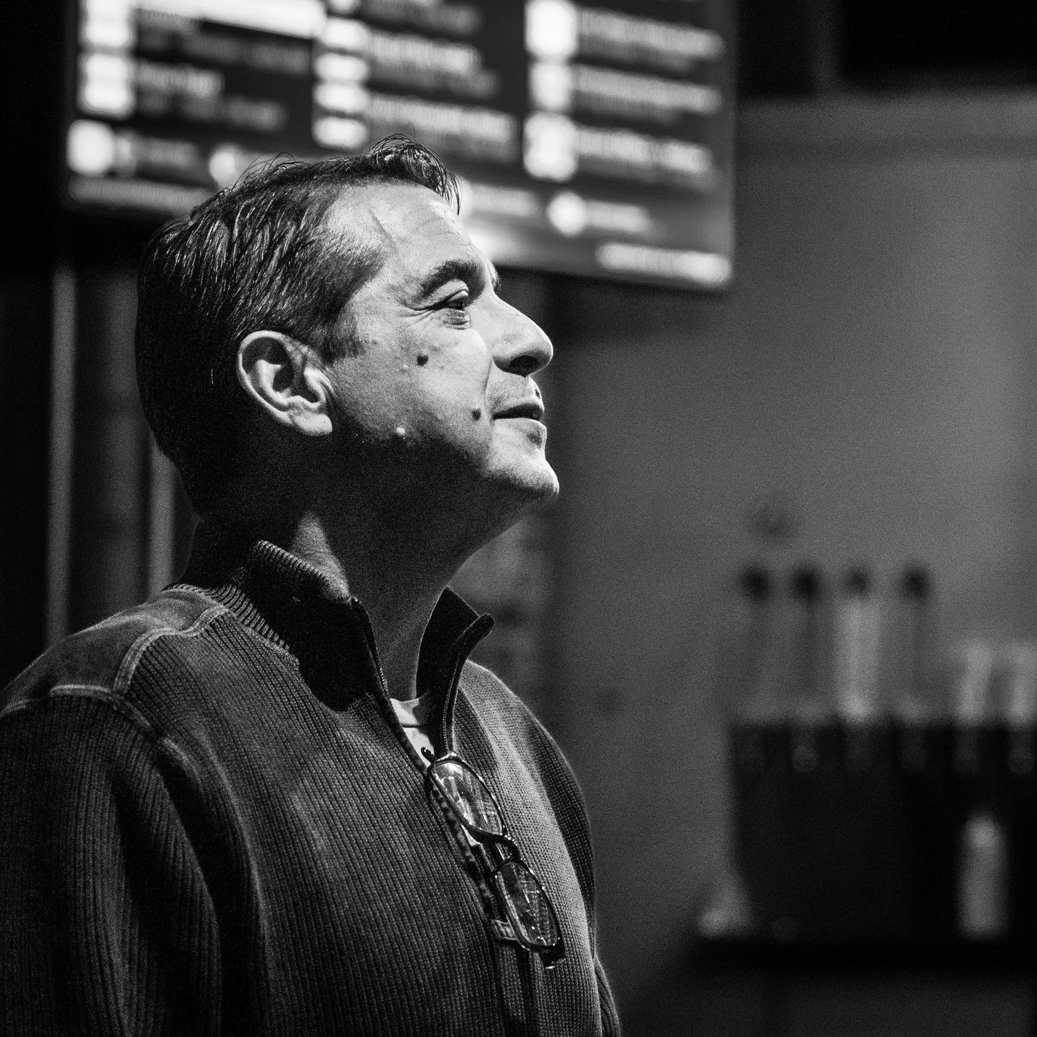 A timeless, black and white portrait of a man looking off-camera