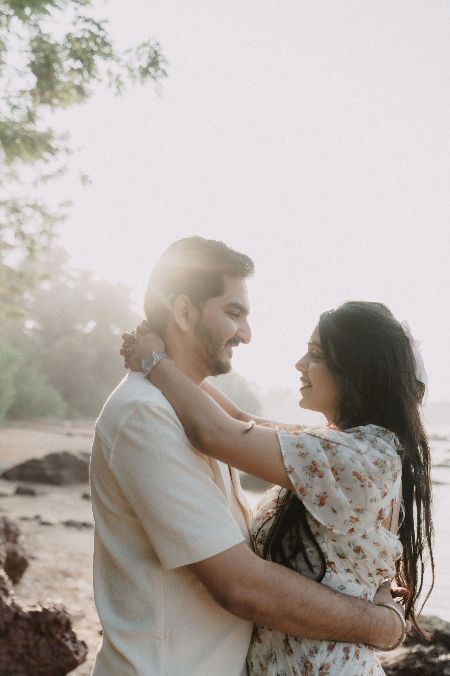 Romantic pre wedding couple embracing in soft sunlit outdoor setting in Goa, naturally captured by Studio RDP