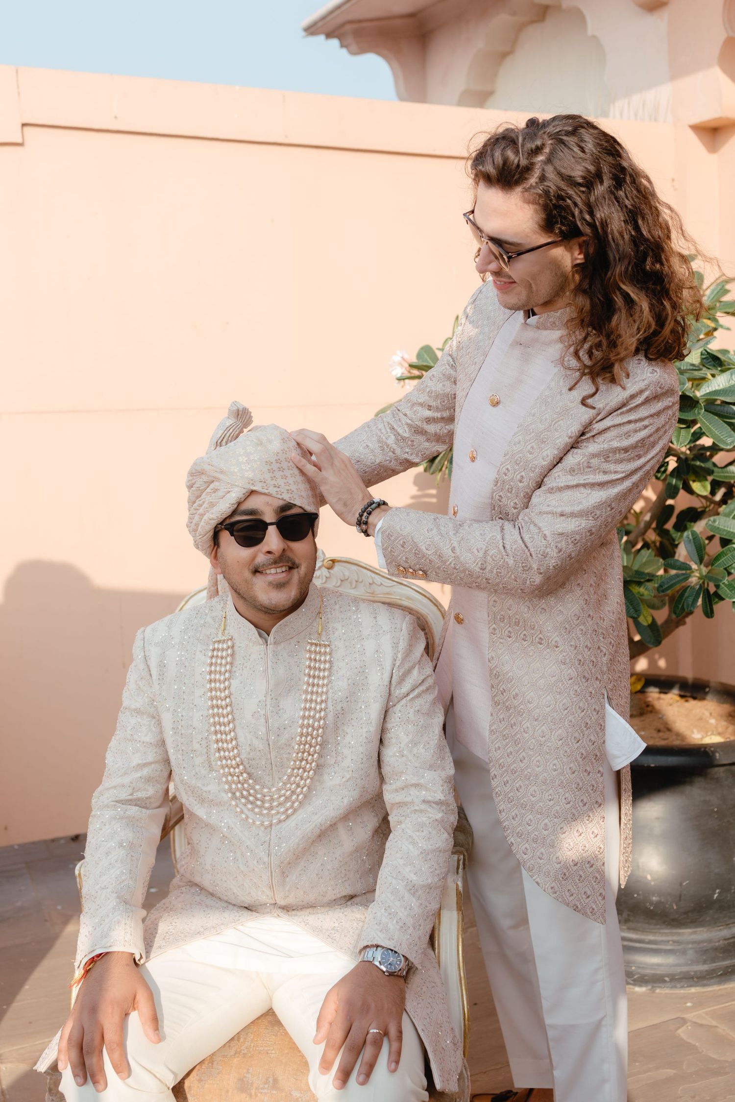 Wedding party in white ethnic wear having fun during pre-wedding celebrations.