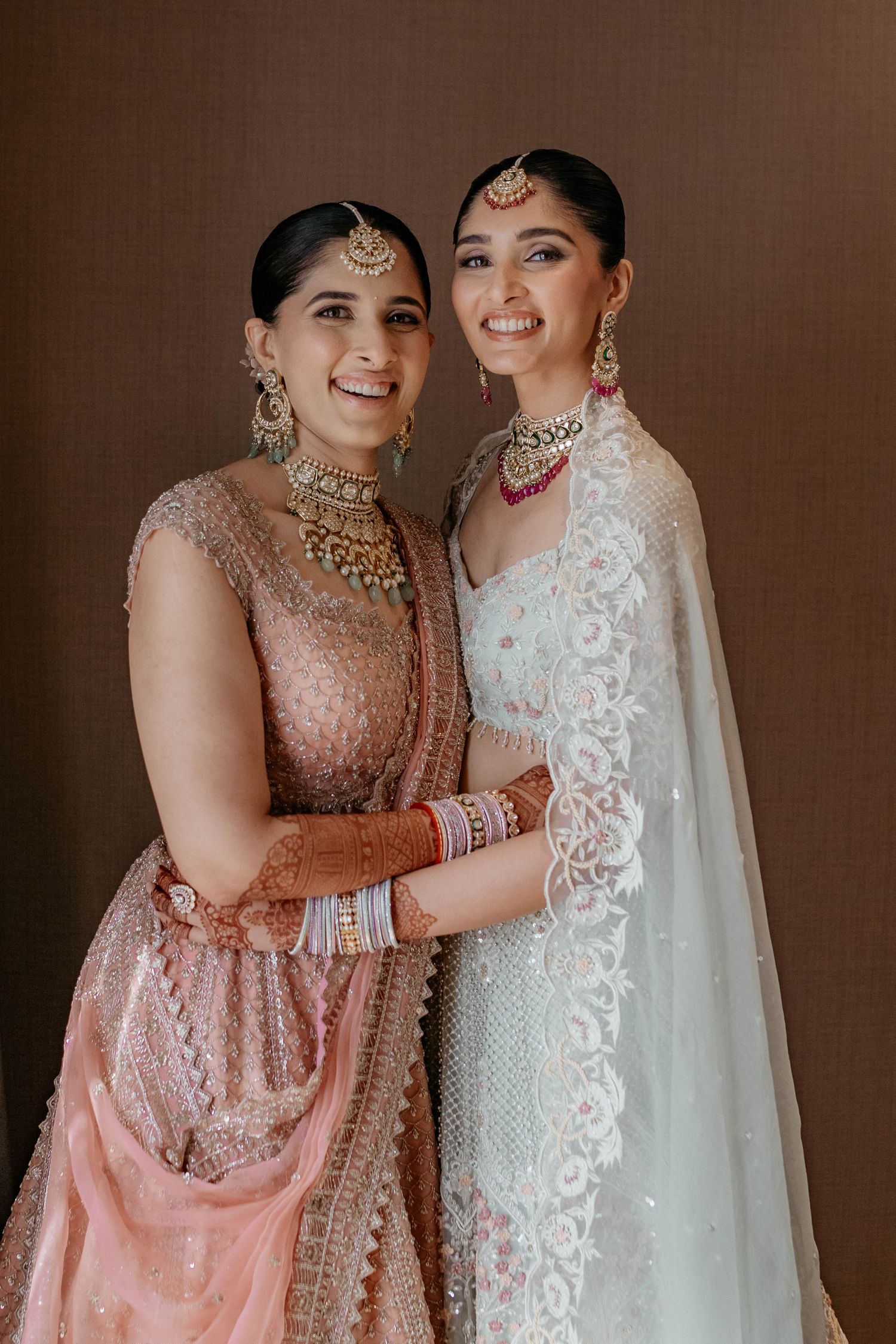 Joyful wedding portrait of Nastasia and Jeet in classic wedding attire at Taj Lands End Mumbai, beautifully photographed by Studio RDP