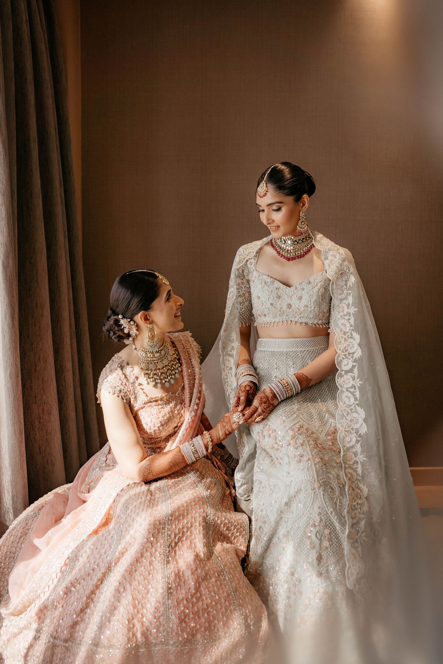 Elegant wedding preparations showing intricate lace dresses in peach and white tones captured in sequential frames.