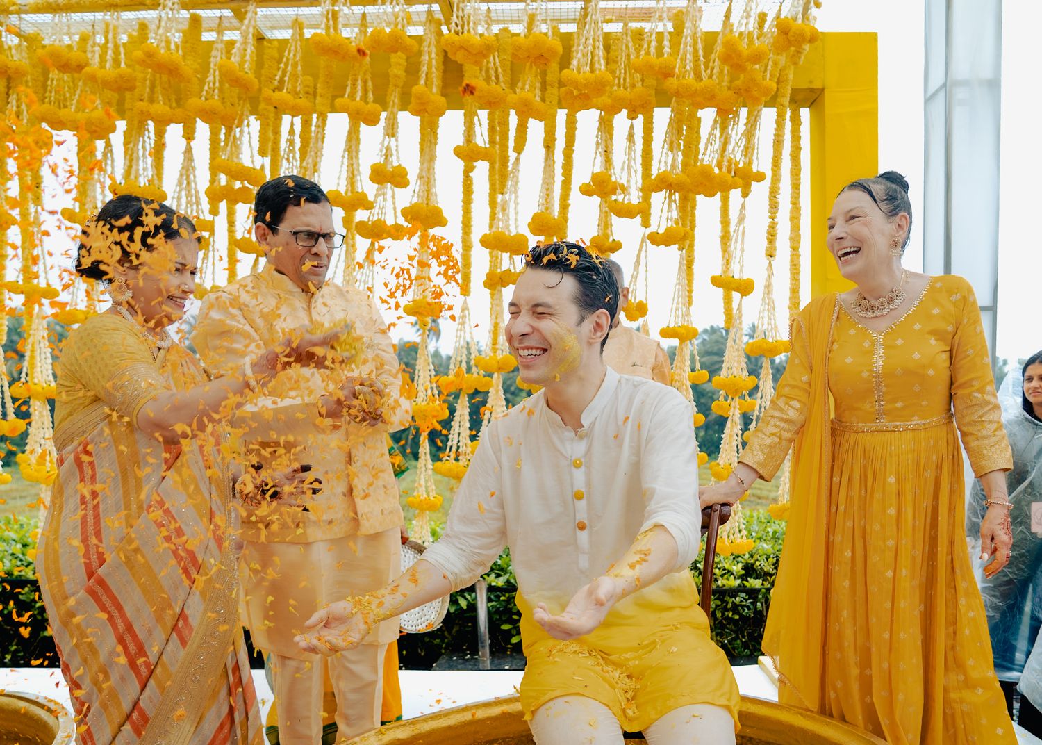 Traditional Indian wedding ceremony with yellow decor and festive atmosphere.