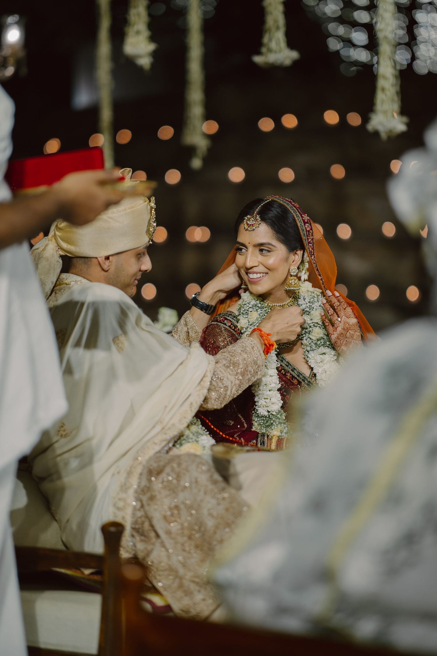 Evening wedding celebration with string lights and elegant decor.