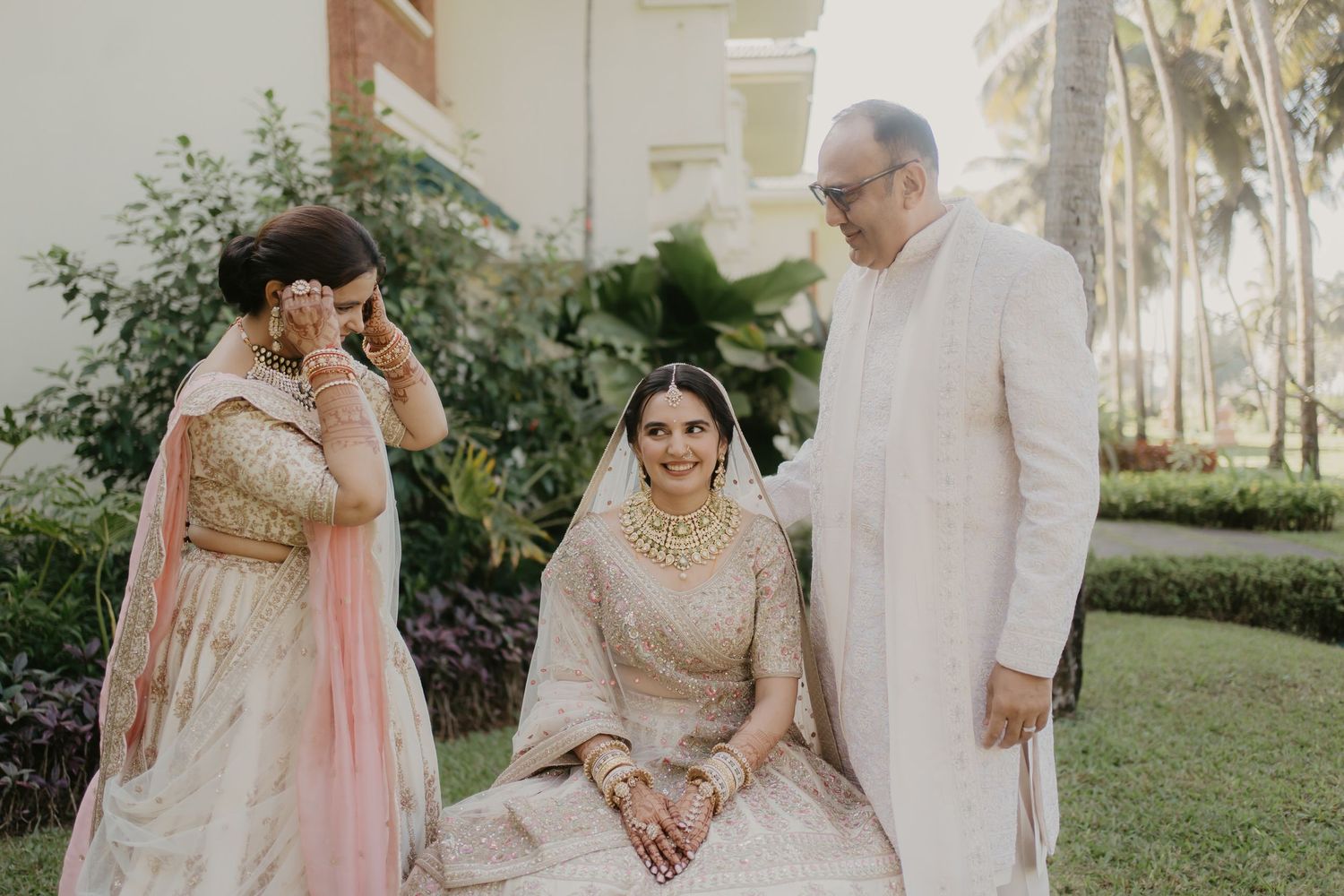 A romantic outdoor wedding photoshoot with the couple embracing in soft sunlit garden settings.