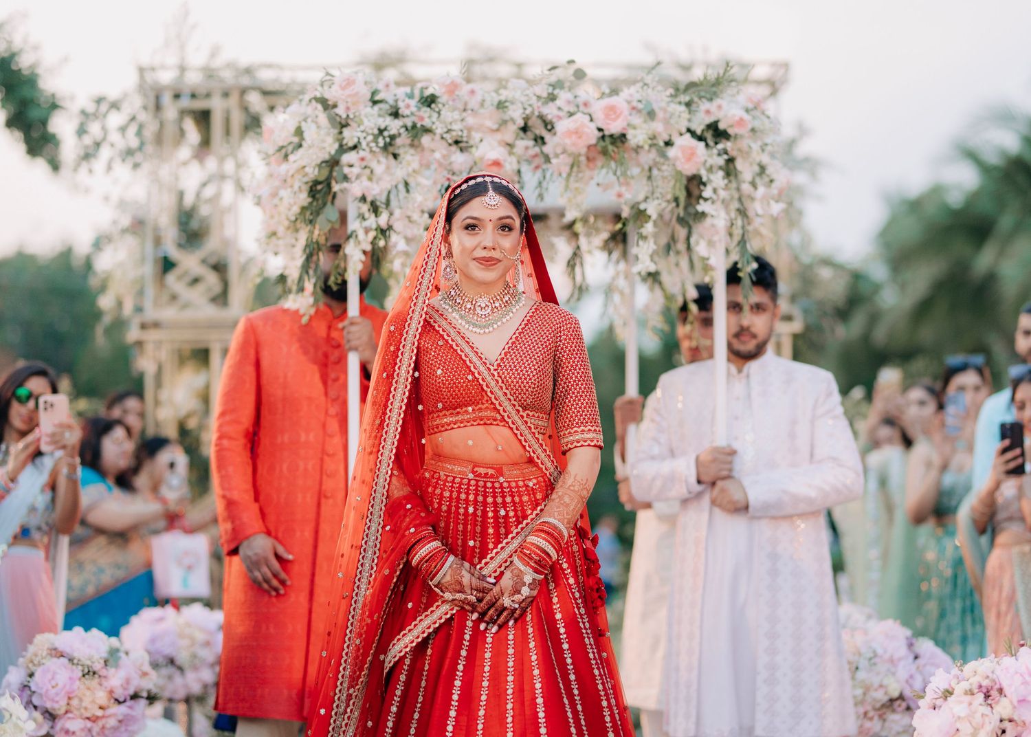 Indian wedding ceremony details in red and white showcasing bridal attire and decor at Juhi and Arjun’s Avani Hua Hin wedding