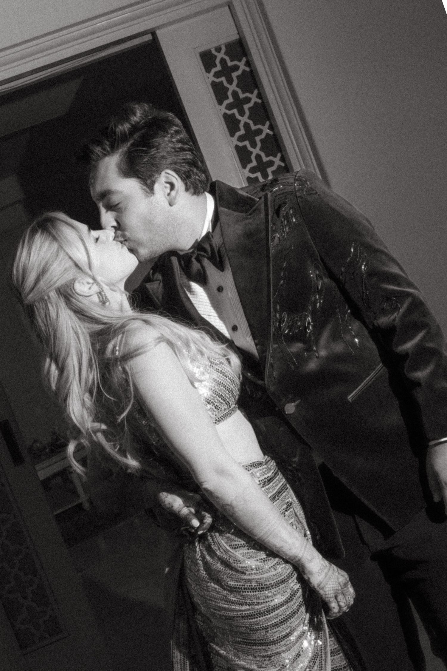 Romantic black and white dance moment at an elegant wedding reception.