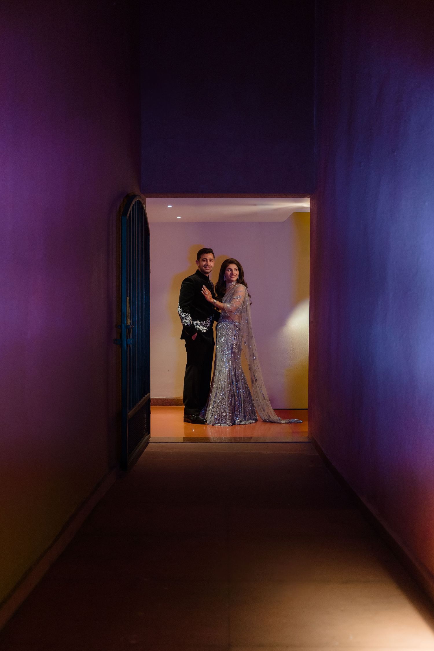 A sequence of photos showing a dark hallway gradually transitioning from empty to having two dancers in formal attire.