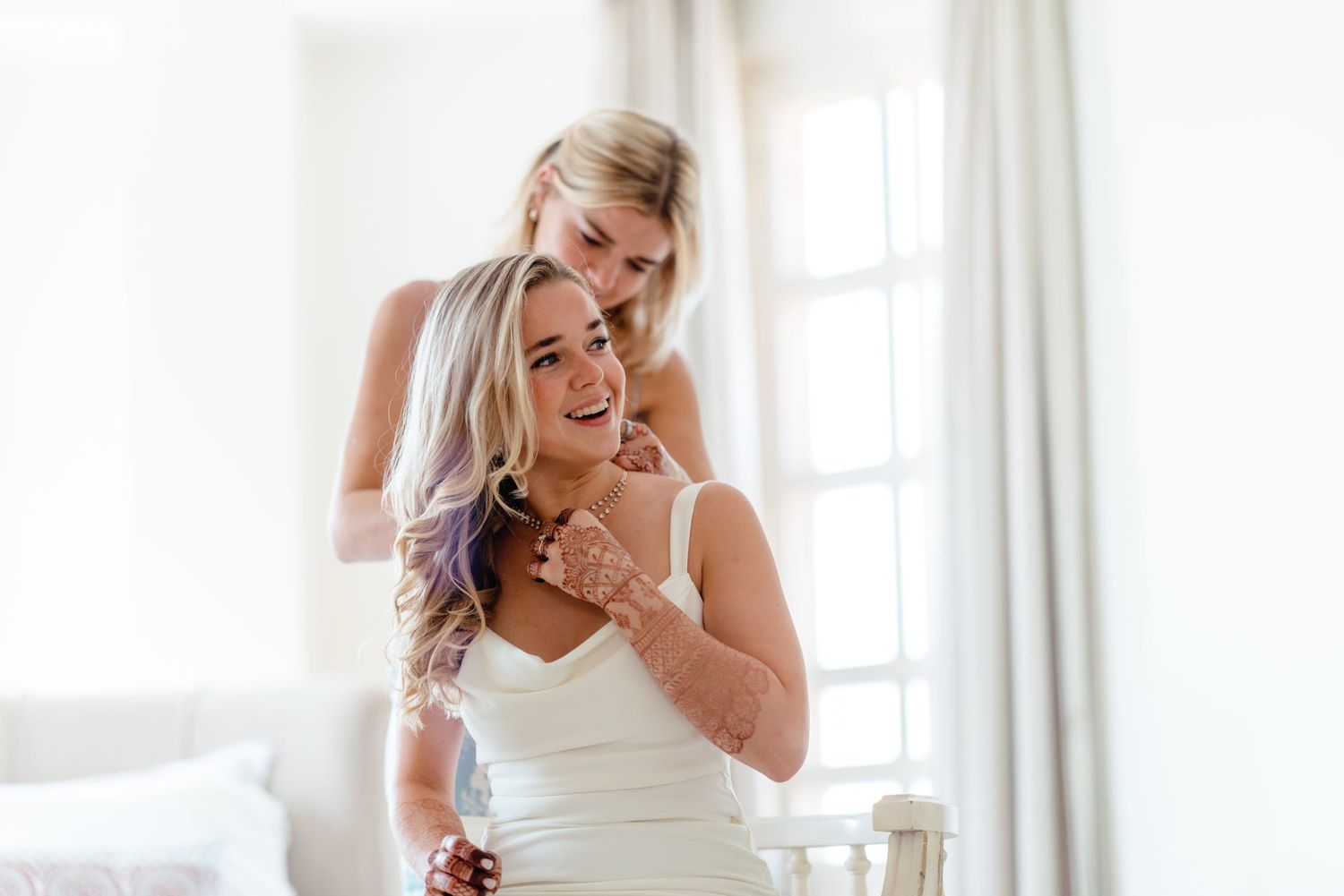 Emotional pre-wedding moments captured in a bright, sunlit room.