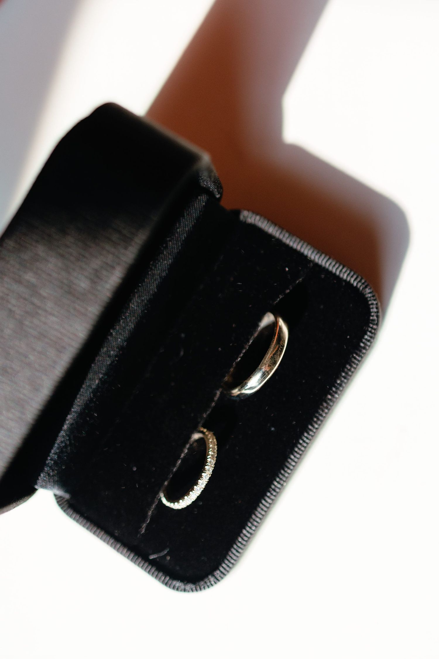 Black velvet ring boxes displayed in a clean, minimalist style.