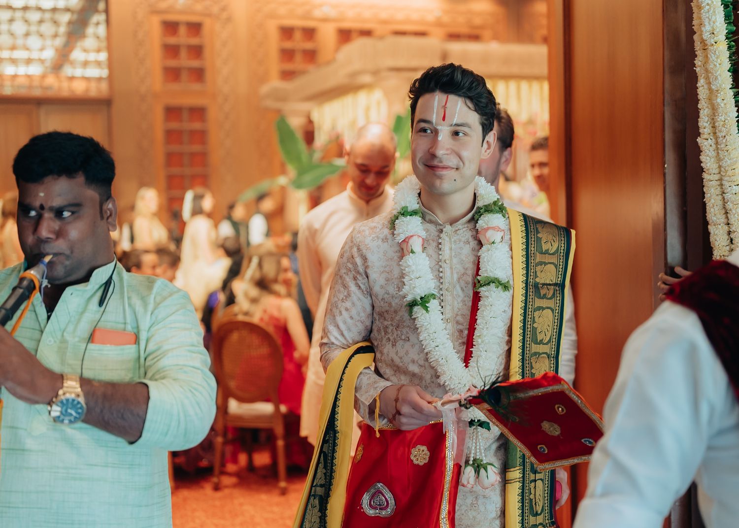Traditional Indian wedding ceremony setup with decorative elements and warm lighting.